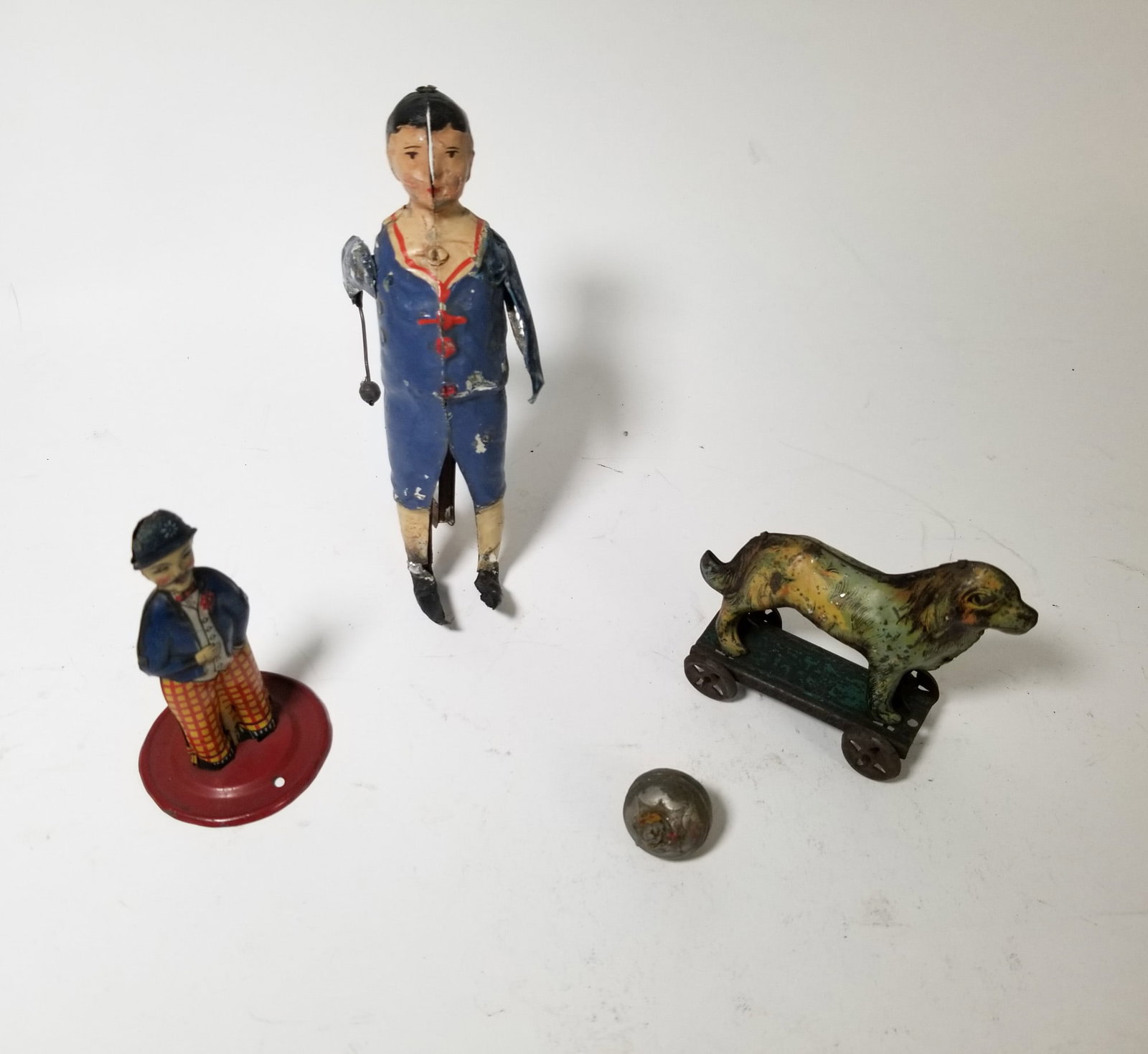Three Early Vintage Tin Toys: Three Early Vintage Tin Toys Size 6" H Literature Brooks Auction – Online Auction Terms & Conditions Contact: (856) 694-2960 | info@brooks.auction READ BEFORE YOU BID: We want you to fee