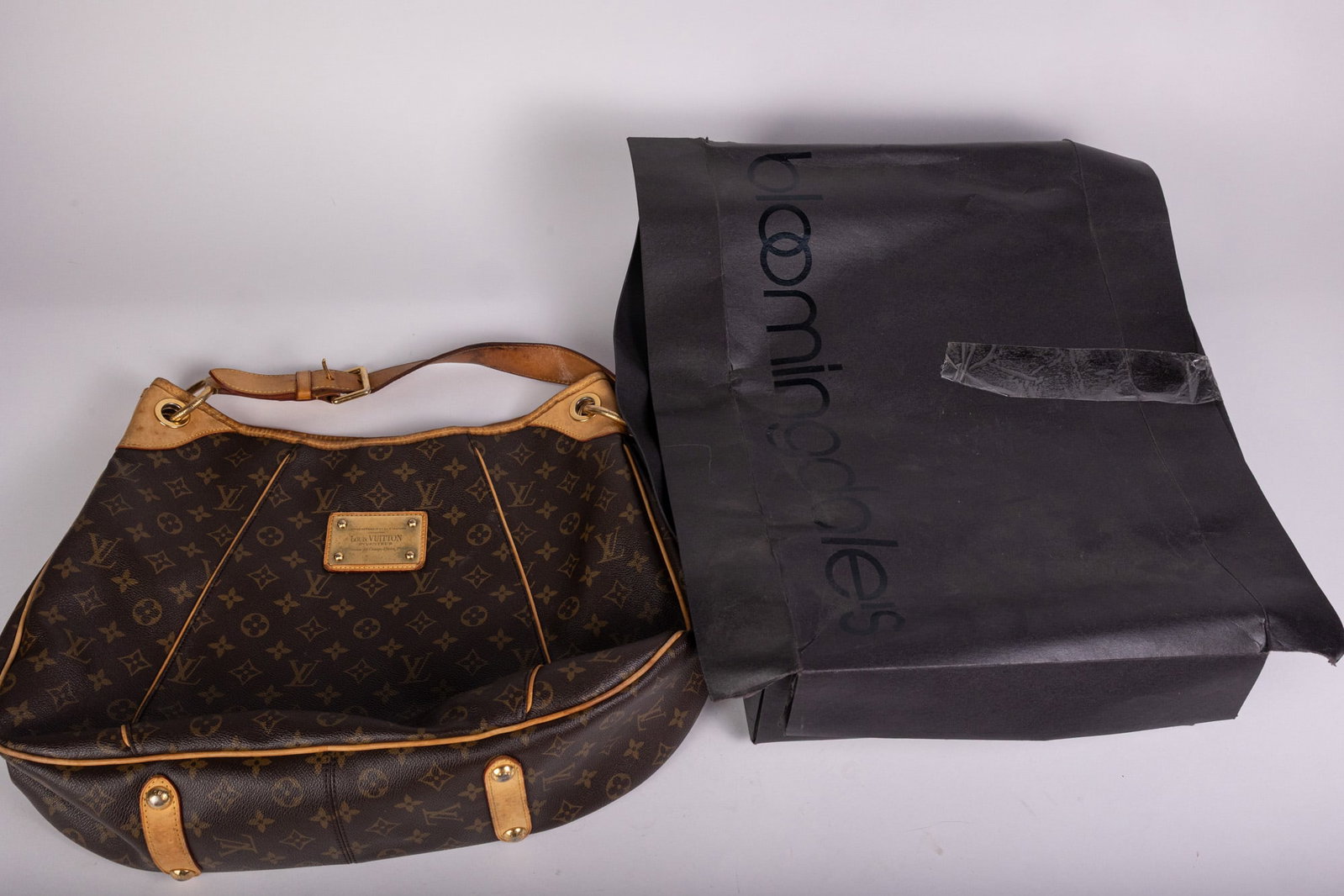 Louis Vuitton Monogram Galliera Handbag: Louis Vuitton Monogram Galliera Handbag: comes in Bloomingdales box, condition is consistent with age and wear from use. Interior has wear and some staining pictured. Literature Brooks Auction
