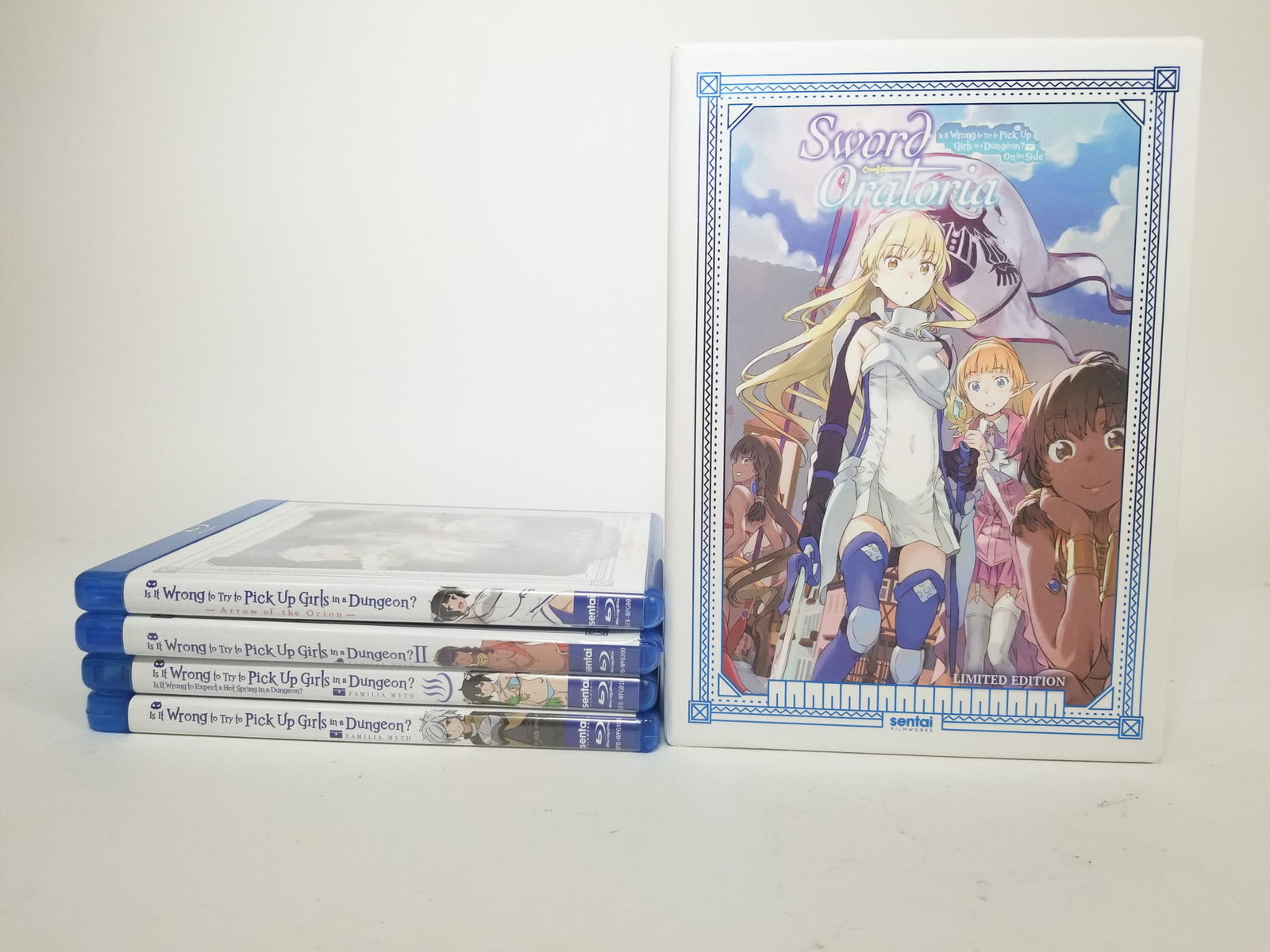 Assorted Is It Wrong to Pick Up Girls in a Dungeon? DVDs: Sword Oratoria Box Set - Is It Wrong to Pick Up Girls in a Dungeon? Size 7" x 12" x 12" Literature Brooks Auction – Online Auction Terms & Conditions Contact: (856) 694-2960 |