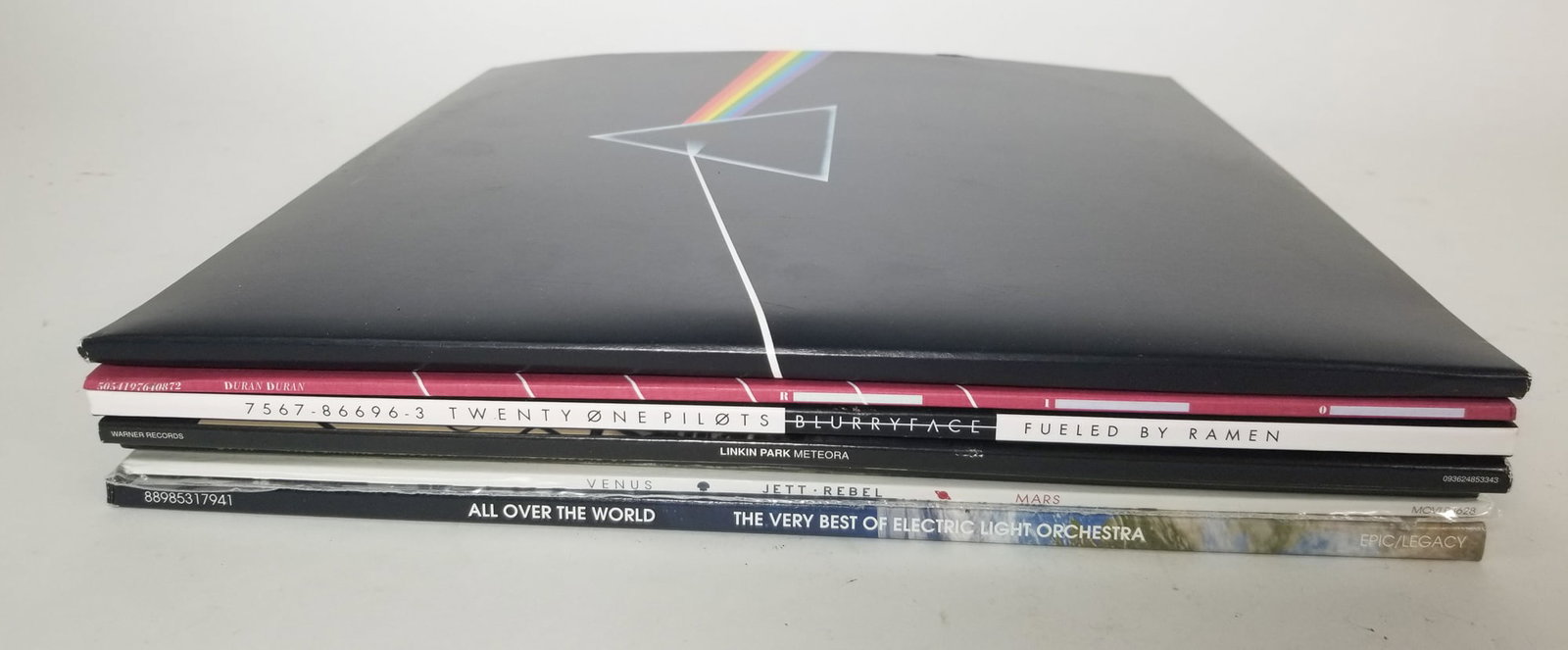 Assorted Rock Vinyls: Twenty One Pilots - Pink Floyd - Duran Duran - and more Size 12" x 12" Literature Brooks Auction – Online Auction Terms & Conditions Contact: (856) 694-2960 | info@brooks.auction READ BEFORE