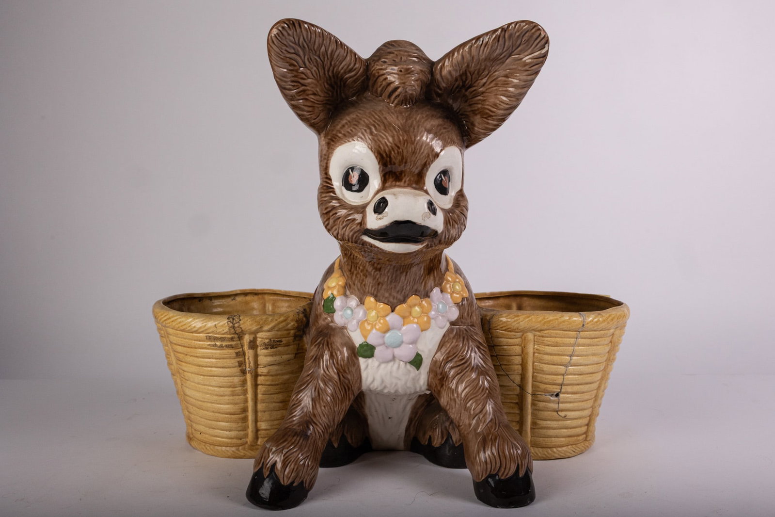 Large Ceramic Mid Century Donkey Planter: Repair to the right hand side of the planter. Size 16" H Literature Brooks Auction – Online Auction Terms & Conditions Contact: (856) 694-2960 | info@brooks.auction READ BEFORE YOU BID: We want