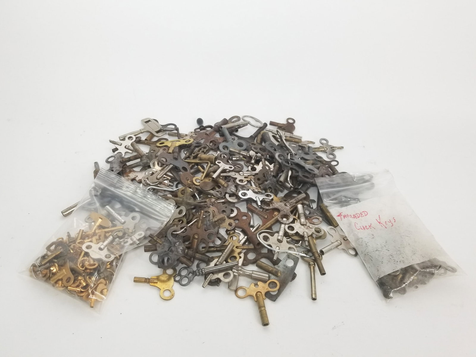 Assortment of Vintage & Antique Clock Keys: Assortment of Vintage & Antique Clock Keys Size 7" x 12" x 12" Literature Brooks Auction – Online Auction Terms & Conditions Contact: (856) 694-2960 | info@brooks.auction READ BEFORE YOU BID: