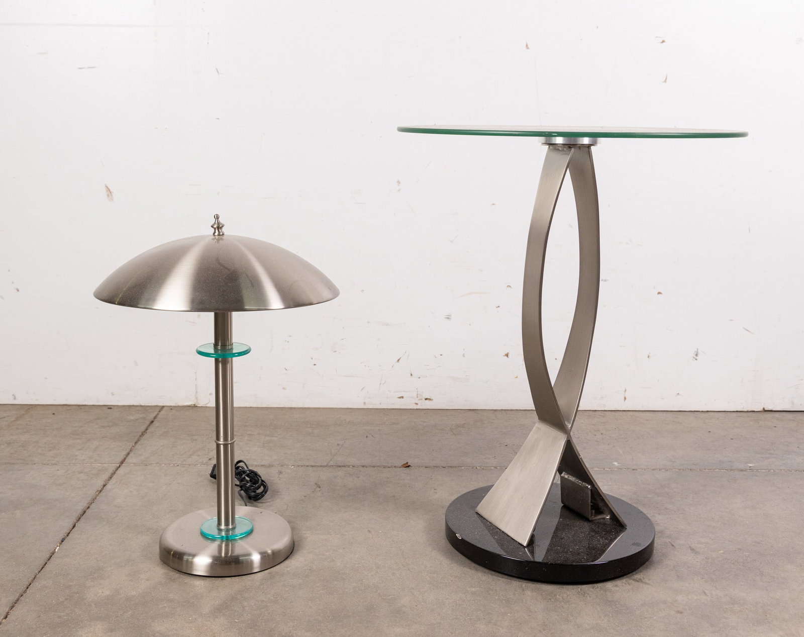 Post Modern Brushed Chrome and Glass Table and Lamp: Post Modern Brushed Chrome and Glass Table and Lamp Size 24" x 18" x 18" Literature Brooks Auction – Online Auction Terms & Conditions Contact: (856) 694-2960 | info@brooks.auction READ BEFORE