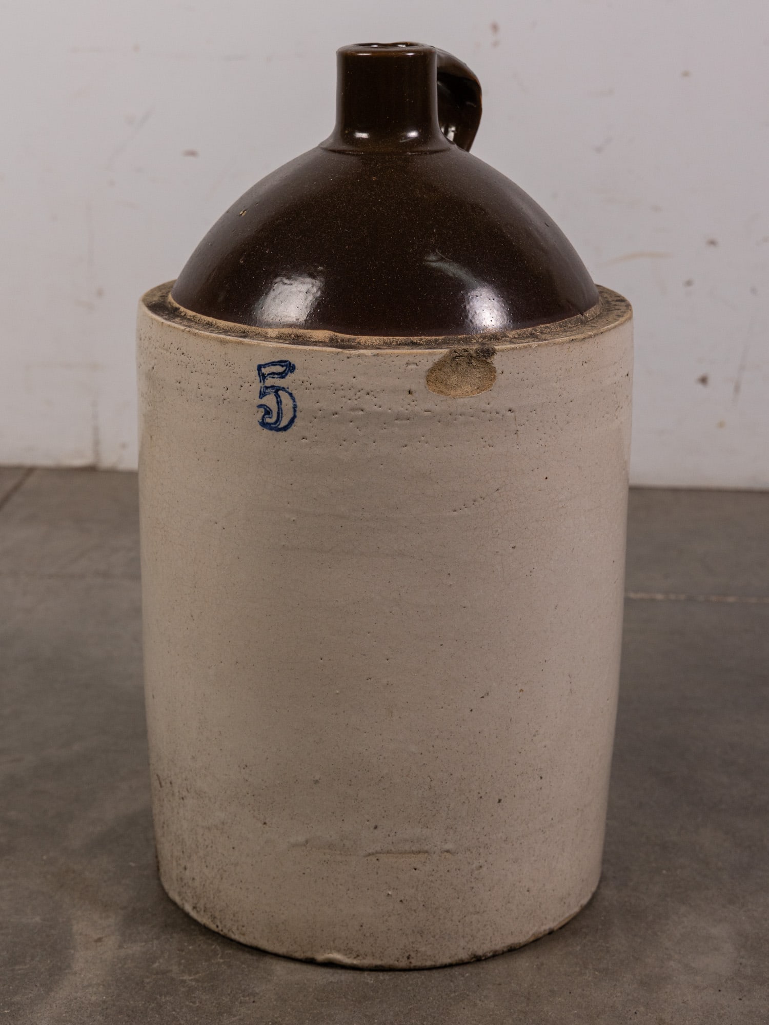 Large Two-Tone Stoneware Jug with Cobalt Marked "5": Large Two-Tone Stoneware Jug with Cobalt Marked "5" Size 21" H Literature Brooks Auction – Online Auction Terms & Conditions Contact: (856) 694-2960 | info@brooks.auction READ BEFORE YOU BID:
