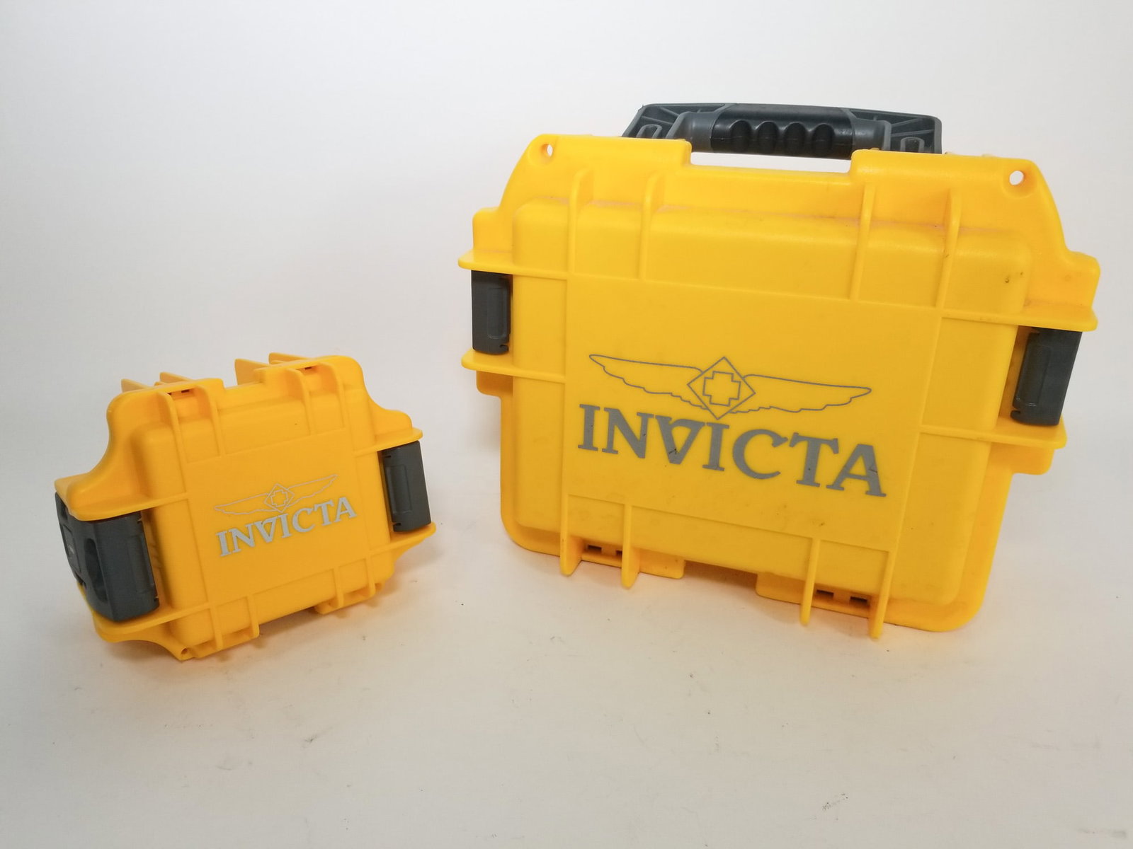 Two Empty Invicta Branded Pelican Cases: Two Empty Invicta Branded Pelican Cases one small one medium Literature Brooks Auction – Online Auction Terms & Conditions Contact: (856) 694-2960 | info@brooks.auction READ BEFORE YOU BID: We w