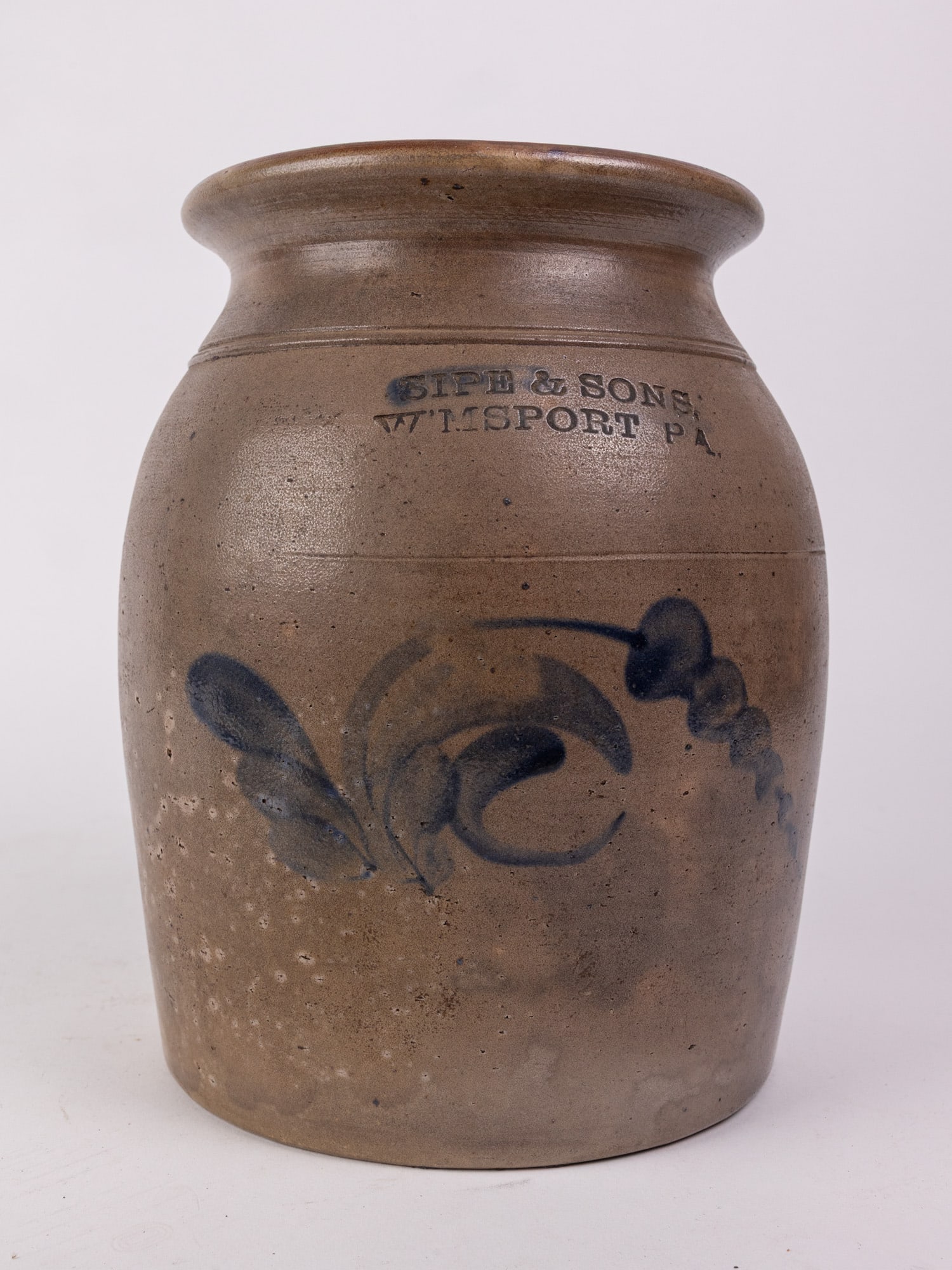 Sipe & Sons Salt Glazed Cobalt Decorated Crock: Salt glazed 10" crock with blue cobalt floral decoration, stamped "Sipe & Sons, W'msport, PA" Size 10" H Literature Brooks Auction – Online Auction Terms & Conditions Contact: (856) 694-2960 |