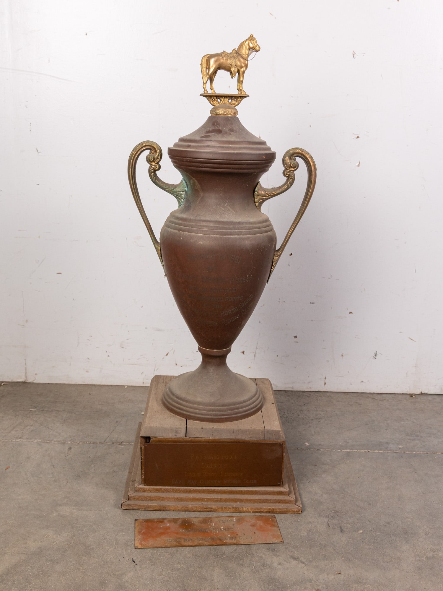 Extra Large Vintage Copper Trophy: Labelled "Freeholders Trophy, Cape May County, Cape May Riding Club". Copper urn shape with ornate brass horse figure and handles, wood base. Size 40" H Literature Brooks Auction – Online