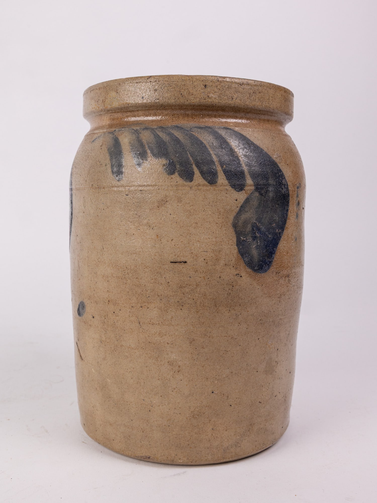 Cobalt Decorated Salt Glazed 9" Stoneware Crock: Minor pitting and one very small hairline crack on interior. Size 9" Literature Brooks Auction – Online Auction Terms & Conditions Contact: (856) 694-2960 | info@brooks.auction READ BEFORE YOU
