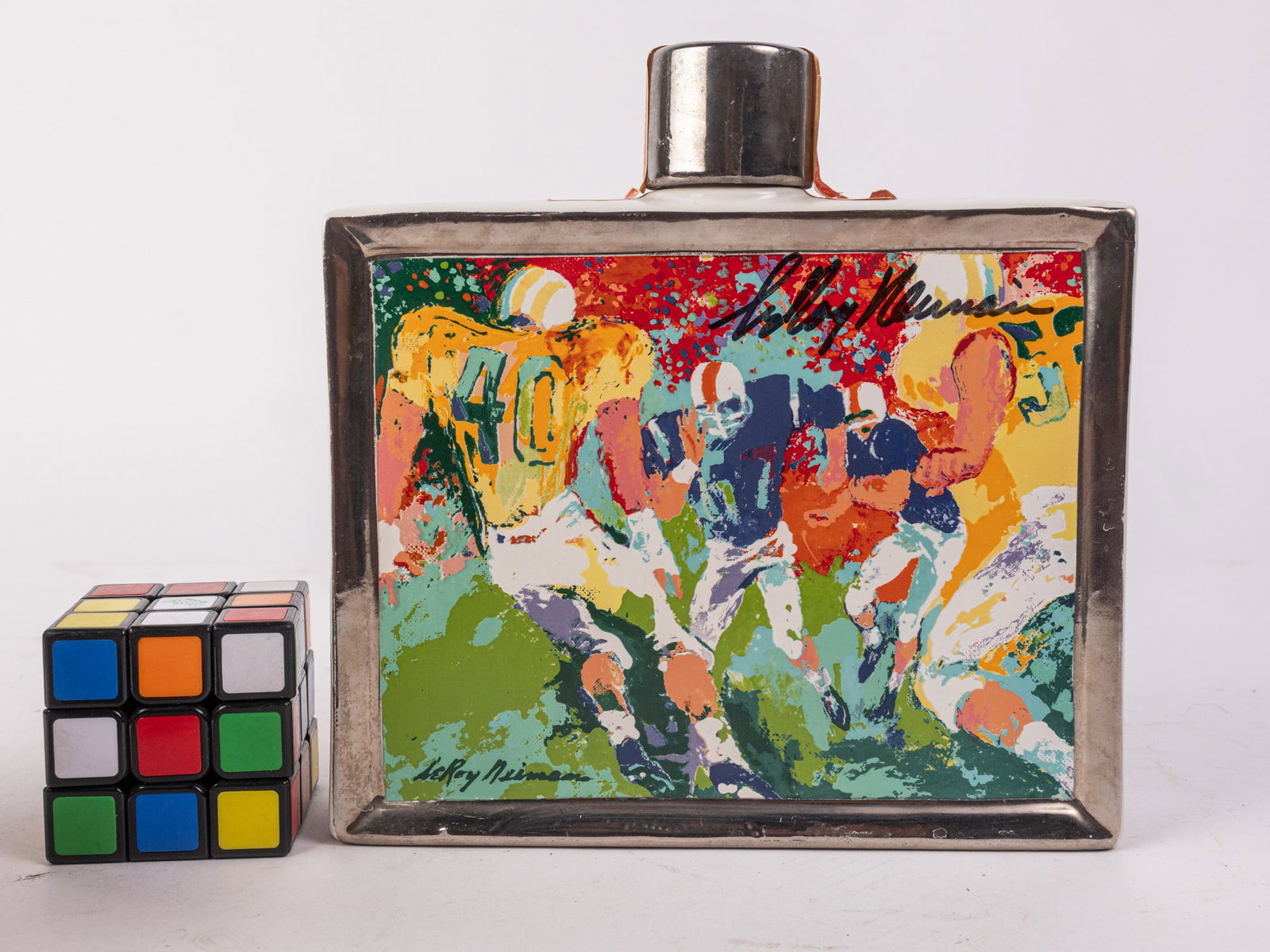 Hand Signed 1979 Leroy Neiman "Football" Sports Commemoratives Whiskey Decanter: Hand Signed 1979 Leroy Neiman "Football" Sports Commemoratives Whiskey Decanter Literature Brooks Auction – Online Auction Terms & Conditions Contact: (856) 694-2960 | info@brooks.auction READ