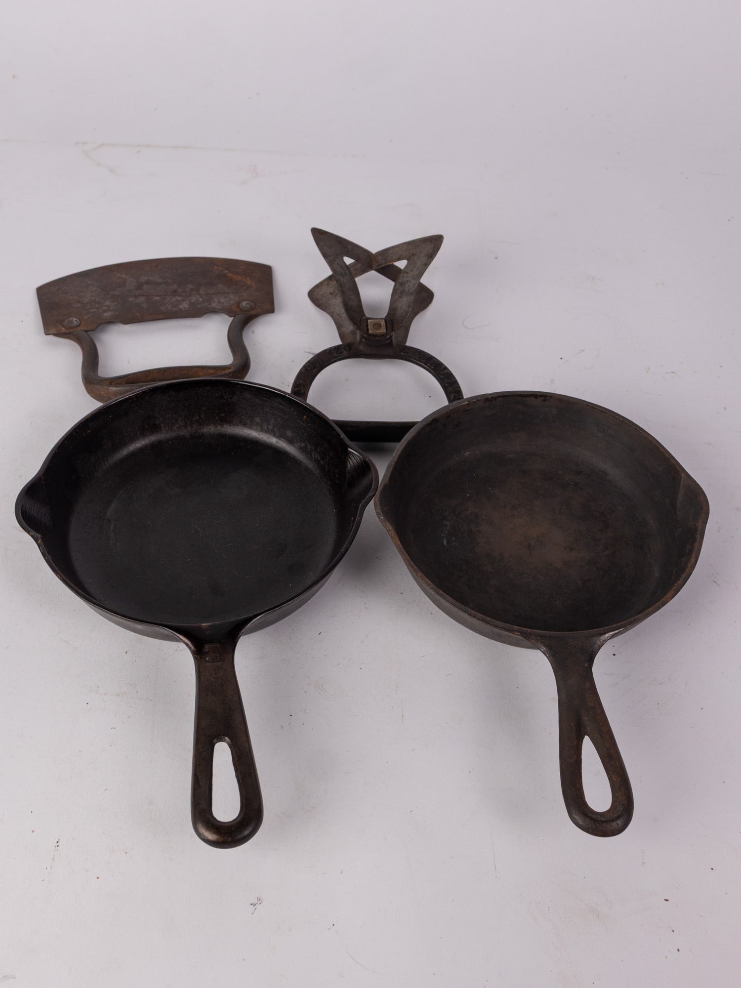 Two Small Cast Iron Frying Pans Featuring Griswold: Two Small Cast Iron Frying Pans Featuring Griswold Size 7" diameter Literature Brooks Auction – Online Auction Terms & Conditions Contact: (856) 694-2960 | info@brooks.auction READ BEFORE YO
