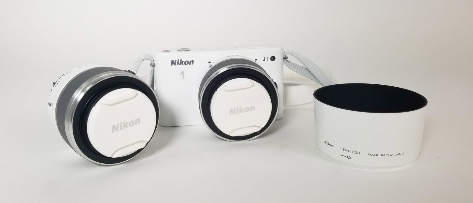 Nikon 1 J1 with Lenses: Nikon 1 J1 with 1 Nikkor 10-30mm, 1 Nikkor 30-110mm Size 5" x 6" x 8" Literature Brooks Auction – Online Auction Terms & Conditions Contact: (856) 694-2960 | info@brooks.auction READ BEFORE YOU