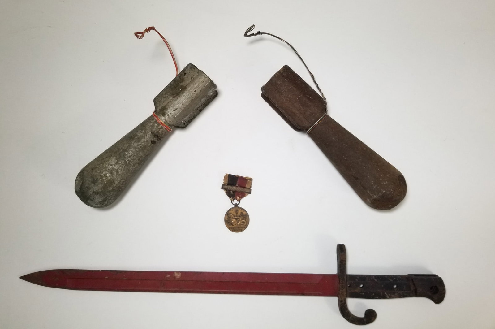 Vintage Military Bayonet and Two Practice Bombs: Vintage Military Bayonet and Two Practice Bombs Size 7" x 12" x 12" Literature Brooks Auction – Online Auction Terms & Conditions Contact: (856) 694-2960 | info@brooks.auction READ BEFORE YOU