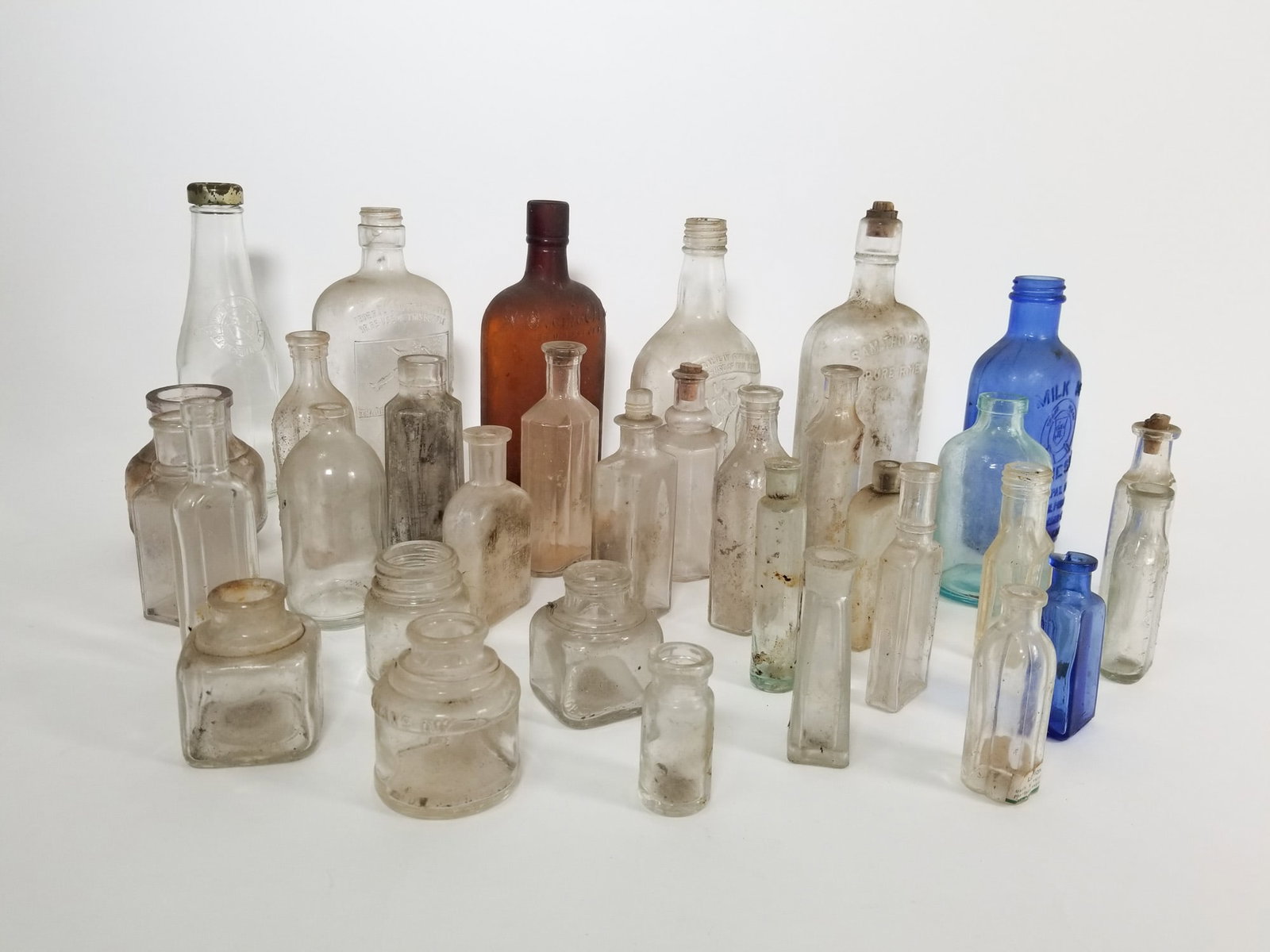 Lot of Assorted Vintage and Antique Glass Bottles: Lot of Assorted Vintage and Antique Glass Bottles Size 7" x 12" x 12" Literature Brooks Auction – Online Auction Terms & Conditions Contact: (856) 694-2960 | info@brooks.auction READ BEFORE YOU