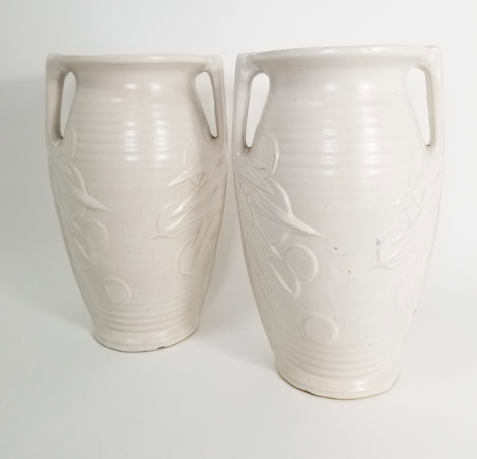 Pair of McCoy Sand Dollar Decorative Vases: Pair of McCoy Sand Dollar Decorative Vases Size 14" H Literature Brooks Auction – Online Auction Terms & Conditions Contact: (856) 694-2960 | info@brooks.auction READ BEFORE YOU BID: We want