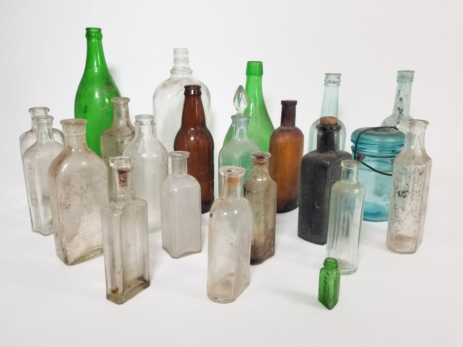 Lot of Assorted Vintage and Antique Bottles: Lot of Assorted Vintage and Antique Bottles Size 7" x 12" x 12" Literature Brooks Auction – Online Auction Terms & Conditions Contact: (856) 694-2960 | info@brooks.auction READ BEFORE YOU BID: