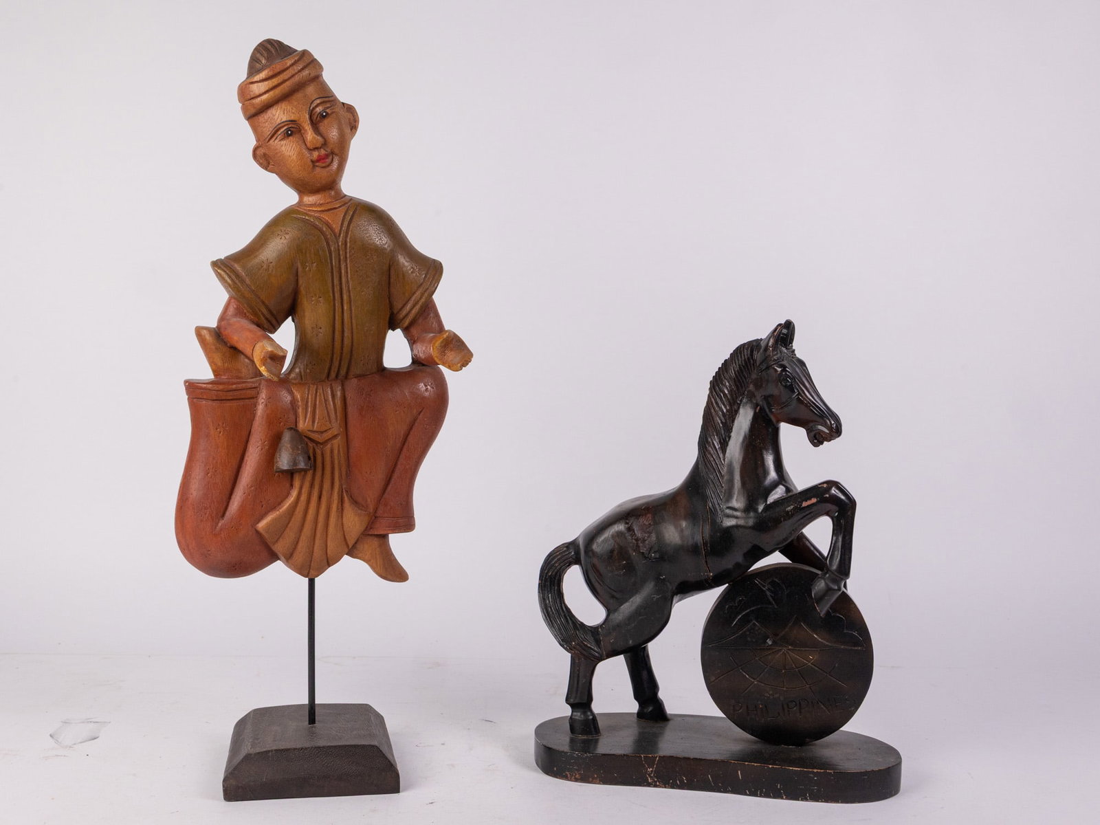 Two Decorative Wooden Sculptures: Two Decorative Wooden Sculptures Size 23" H Literature Brooks Auction – Online Auction Terms & Conditions Contact: (856) 694-2960 | info@brooks.auction READ BEFORE YOU BID: We want you t