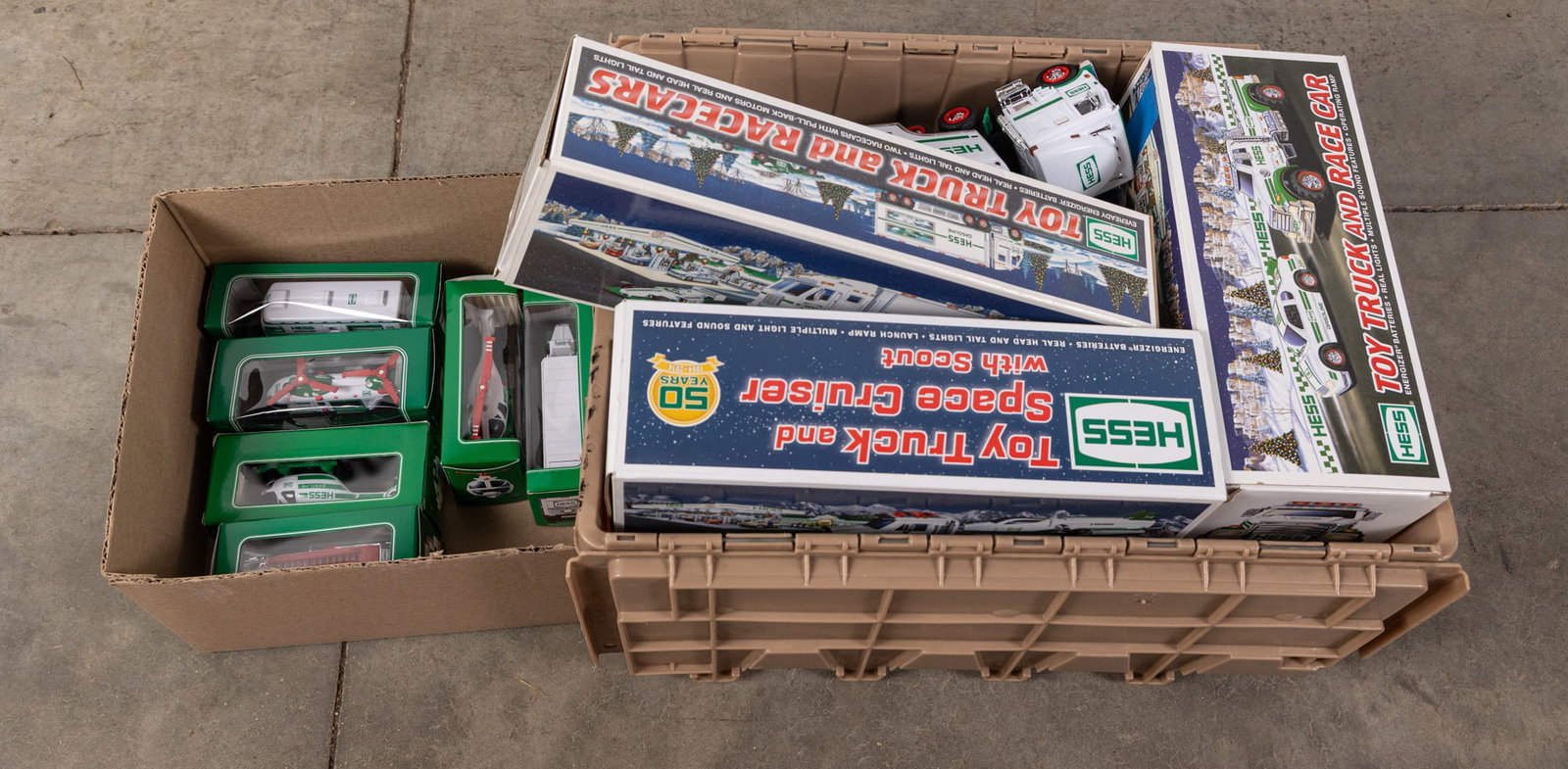 Assortment of Hess Trucks: Toy Truck and Racecars - Toy Truck and Space Cruise with Scout - Miniatures - and more! Size 9" x 22" x 16" Literature Brooks Auction – Online Auction Terms & Conditions Contact: (856) 694-2960