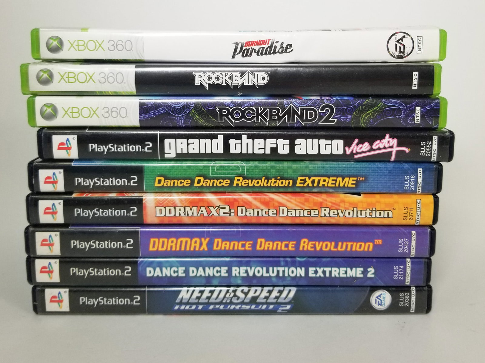 Assortment of Video Games: Dance Dance Revolution - Rock Band - GTA Vice City - and more! Size 7" x 12" x 12" Literature Brooks Auction – Online Auction Terms & Conditions Contact: (856) 694-2960 | info@brooks.auction