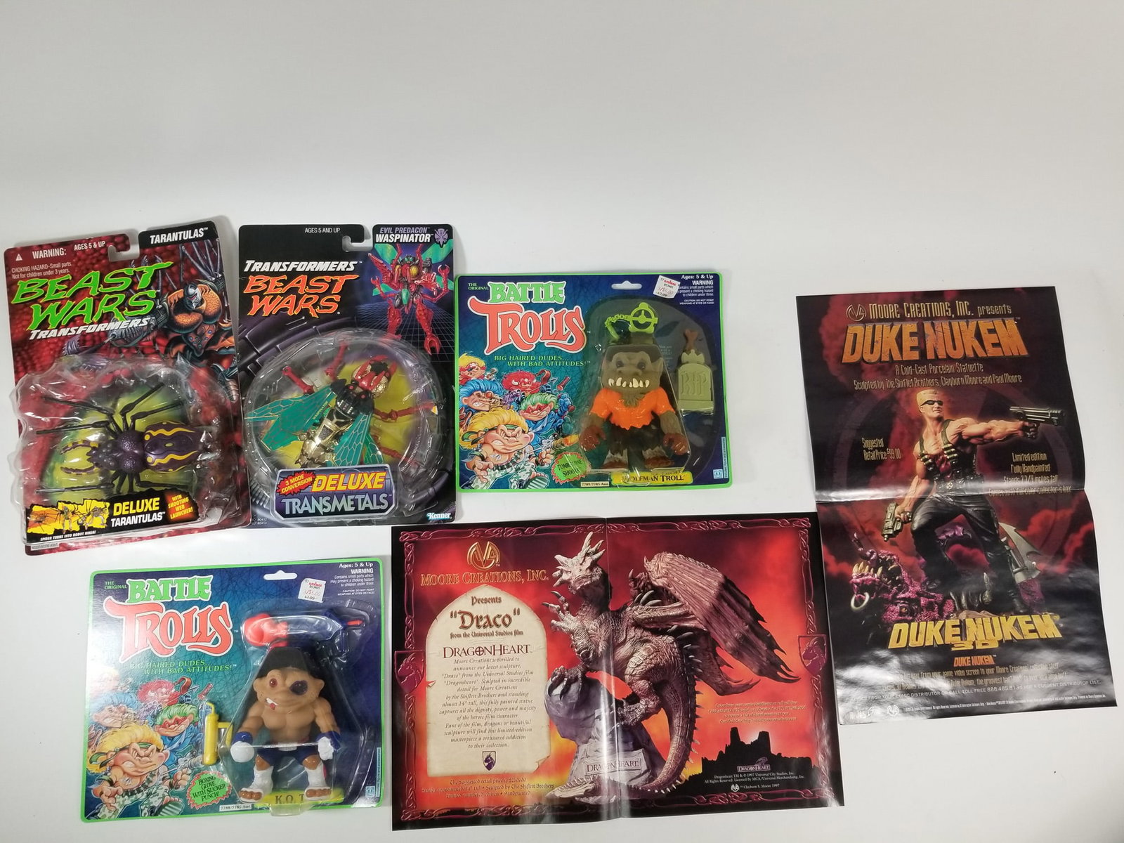 Assortment of Monster Action Figures and Game Posters (1 of 2)
