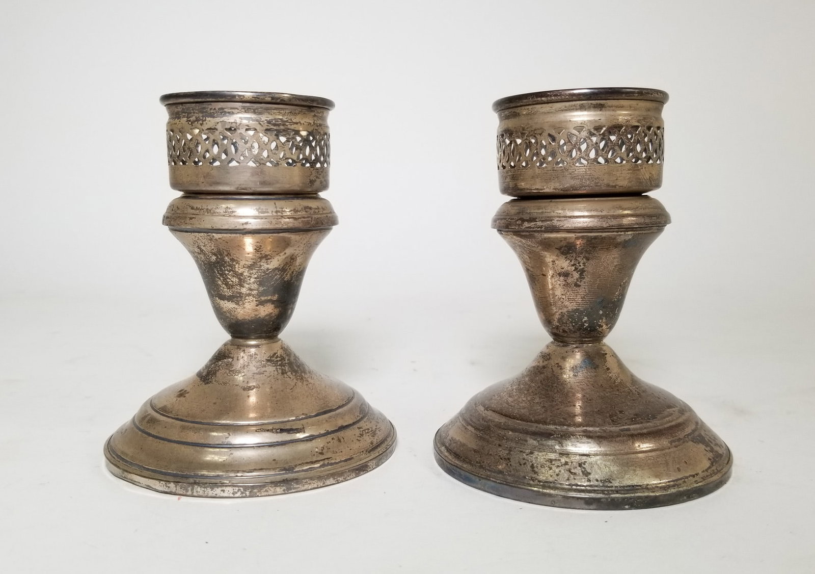 Pair of Lady Atkins Sterling Weighted Candle Holders: Pair of Lady Atkins Sterling Weighted Candle Holders Literature Brooks Auction – Online Auction Terms & Conditions Contact: (856) 694-2960 | info@brooks.auction READ BEFORE YOU BID: We want you