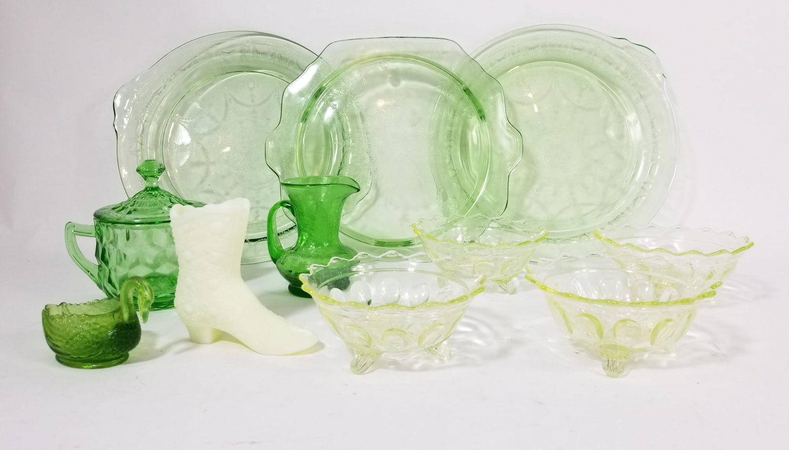 Assortment of Uranium Glass: Assortment of Uranium Glass Size 7" x 12" x 12" Literature Brooks Auction – Online Auction Terms & Conditions Contact: (856) 694-2960 | info@brooks.auction READ BEFORE YOU BID: We want you to