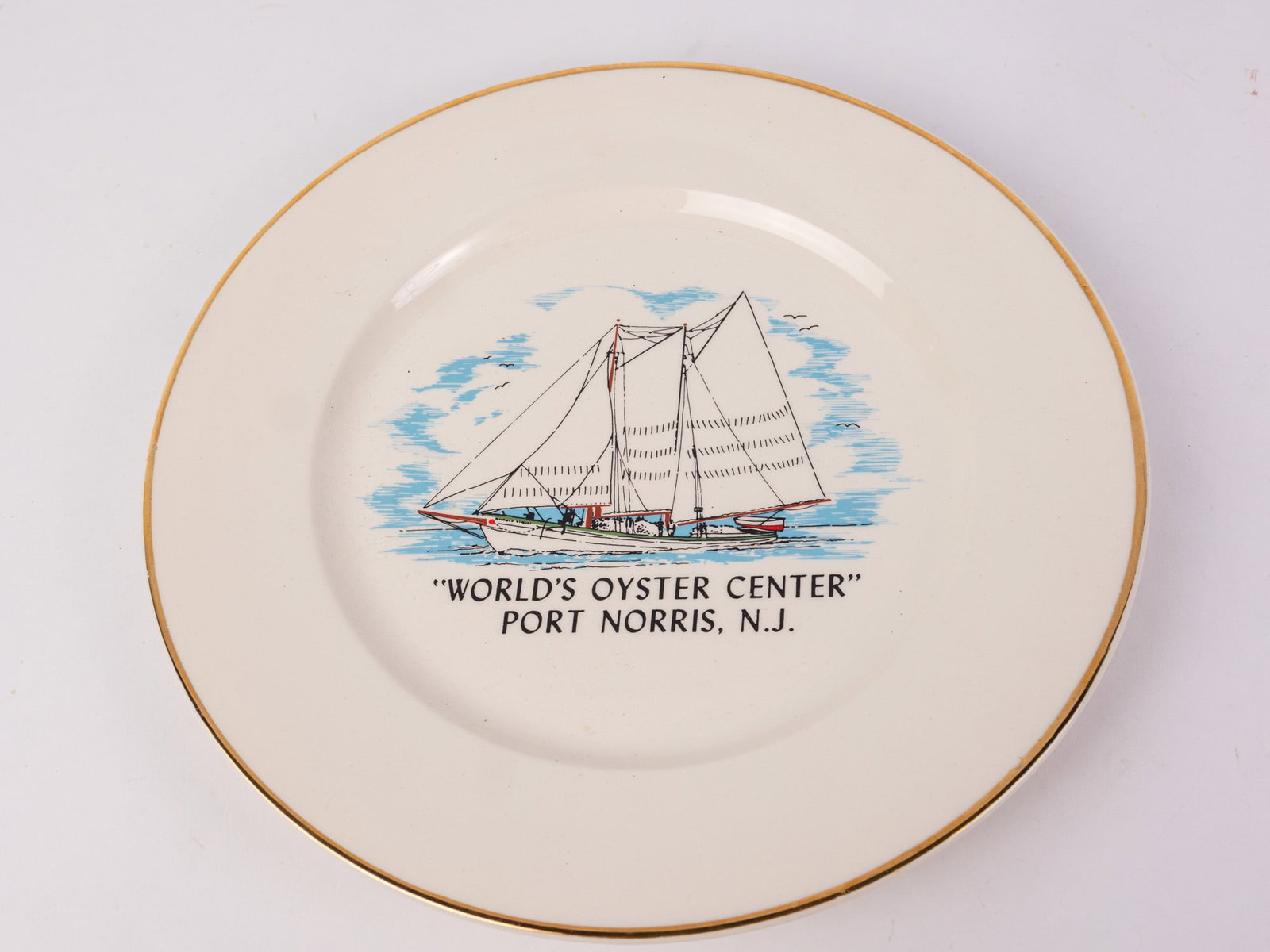 "World's Oyster Center, Port Norris, NJ" Vintage Ceramic Plate: "World's Oyster Center, Port Norris, NJ" Vintage Ceramic Plate Literature Brooks Auction – Online Auction Terms & Conditions Contact: (856) 694-2960 | info@brooks.auction READ BEFORE YOU BID: We
