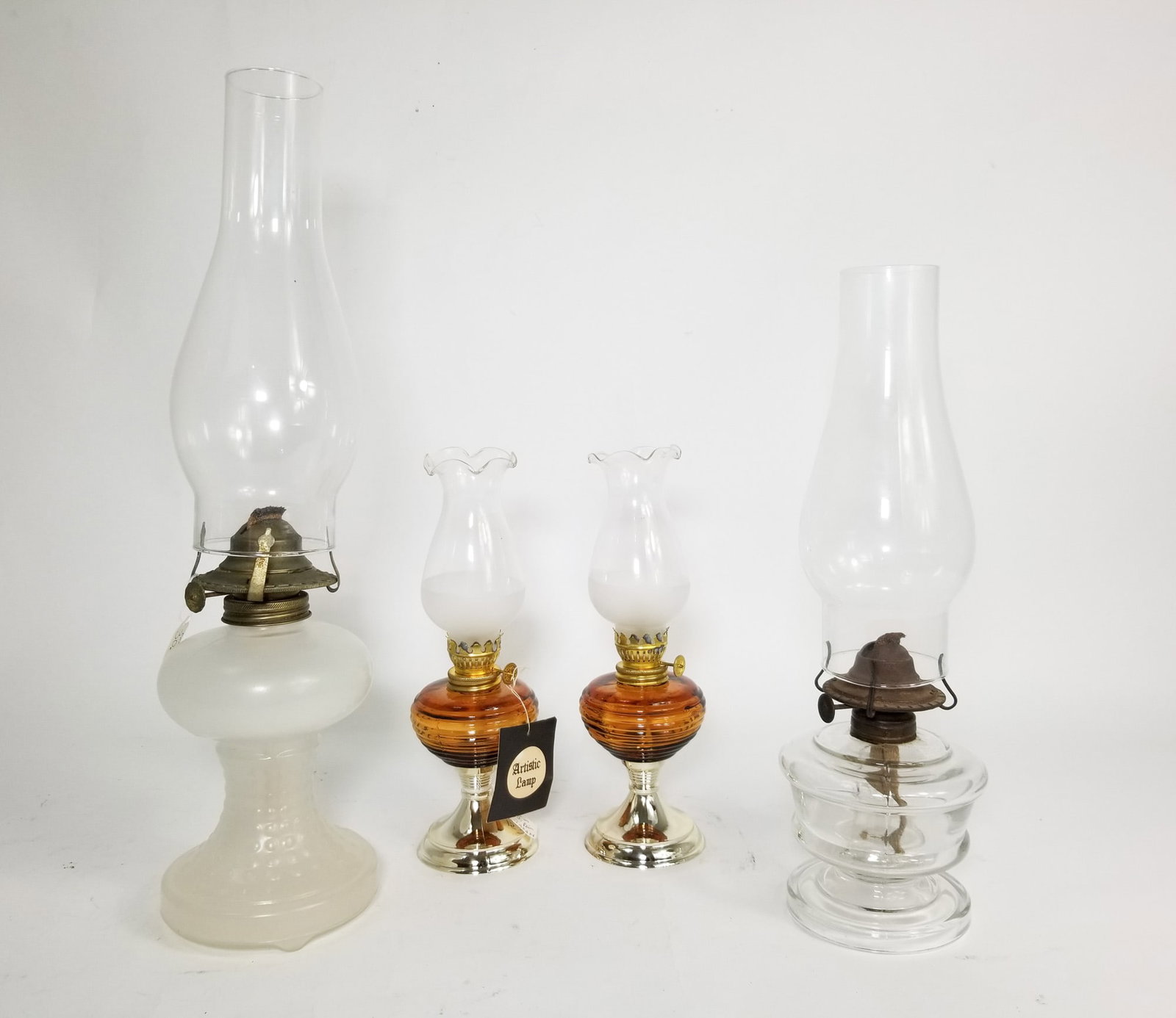 Assortment of Antique Oil Kerosene Lamps: Assortment of Antique Oil Kerosene Lamps Size 18H Literature Brooks Auction – Online Auction Terms & Conditions Contact: (856) 694-2960 | info@brooks.auction READ BEFORE YOU BID: We want you to