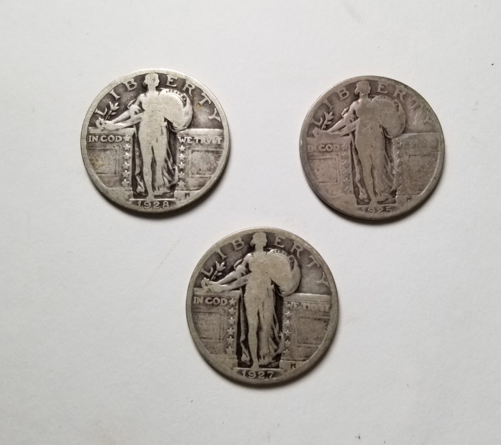 Three Standing Liberty Silver Quarters: (3) Standing Liberty Silver Quarters: 1925 - 1927 - 1928 Literature Brooks Auction – Online Auction Terms & Conditions Contact: (856) 694-2960 | info@brooks.auction READ BEFORE YOU BID: We want