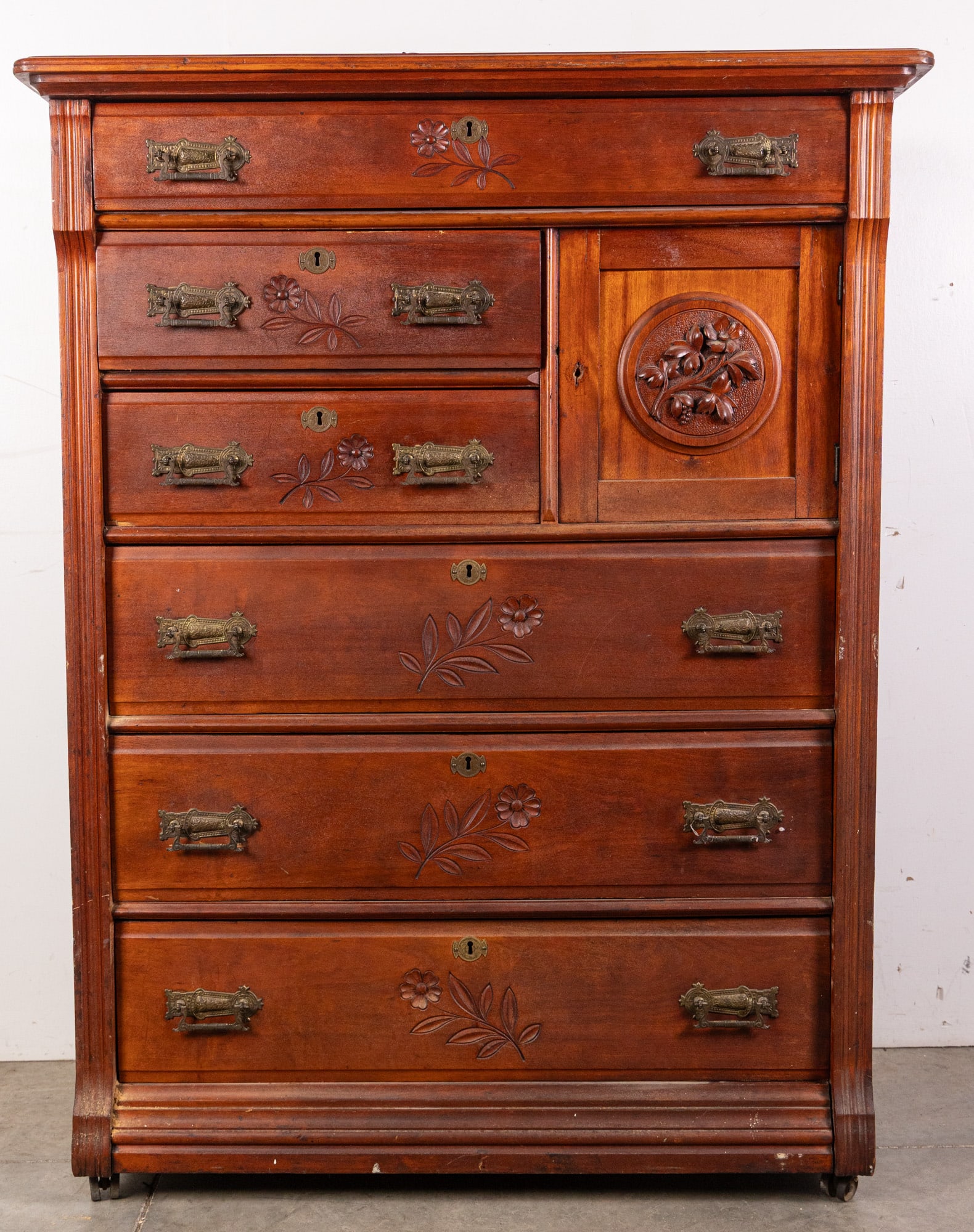 Antique 19th Century Victorian Chest of Drawers: Gorgeous late 19th century chest with unique carved floral details and ornate original fixtures. Square compartment is locked and unable to be opened. Size 53" x 40" x 20" Literature Brooks Auction