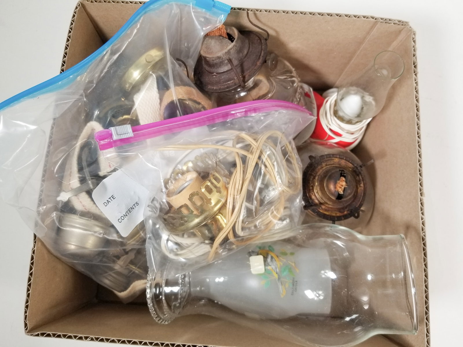 Assorted Small Oil Lamps & Spare Parts: Assorted Small Oil Lamps & Spare Parts Size 7" x 12" x 12" Literature Brooks Auction – Online Auction Terms & Conditions Contact: (856) 694-2960 | info@brooks.auction READ BEFORE YOU BID: We