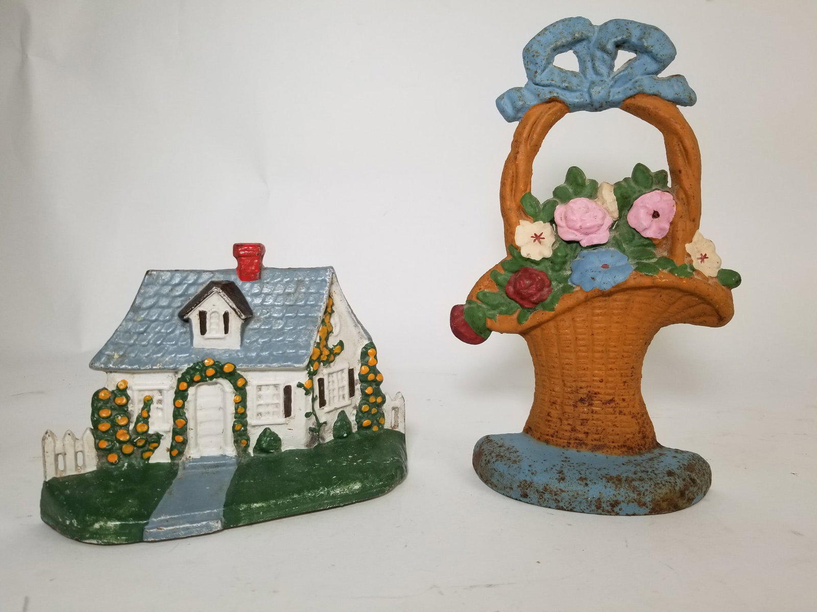 Pair of Cast Iron Painted Door Stops: Pair of Cast Iron Painted Door Stops Size 11" x 7" Literature Brooks Auction – Online Auction Terms & Conditions Contact: (856) 694-2960 | info@brooks.auction READ BEFORE YOU BID: We want you