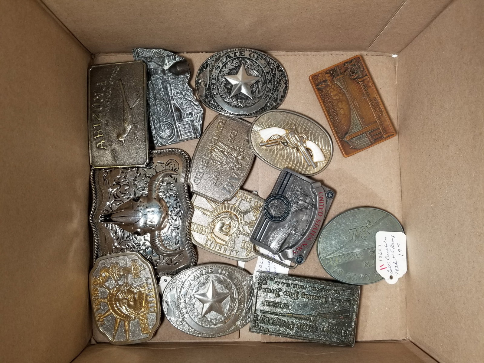 Assortment of Vintage Belt Buckles: Assortment of Vintage Belt Buckles Size 7" x 12" x 12" Literature Brooks Auction – Online Auction Terms & Conditions Contact: (856) 694-2960 | info@brooks.auction READ BEFORE YOU BID: We want