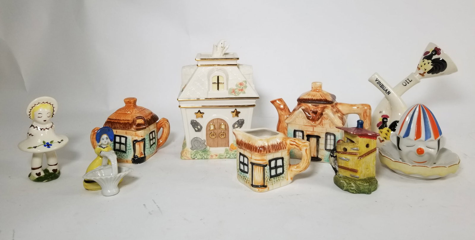 Assortment of Ceramic Kitchen Decor: Assortment of Ceramic Kitchen Decor Size 7" x 12" x 12" Literature Brooks Auction – Online Auction Terms & Conditions Contact: (856) 694-2960 | info@brooks.auction READ BEFORE YOU BID: We want