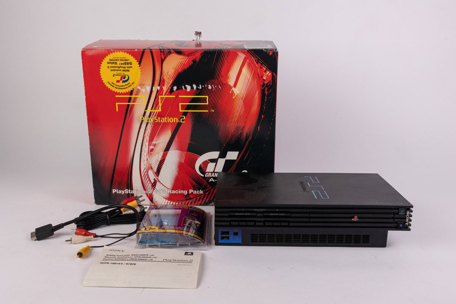 Playstation 2 GT3 Gran Turismo Racing Pack: Includes console, box, and cords as shown. Does not include game or any accessories besides what is pictured. Size 5" x 14" x 12" Literature Brooks Auction – Online Auction Terms & Conditions