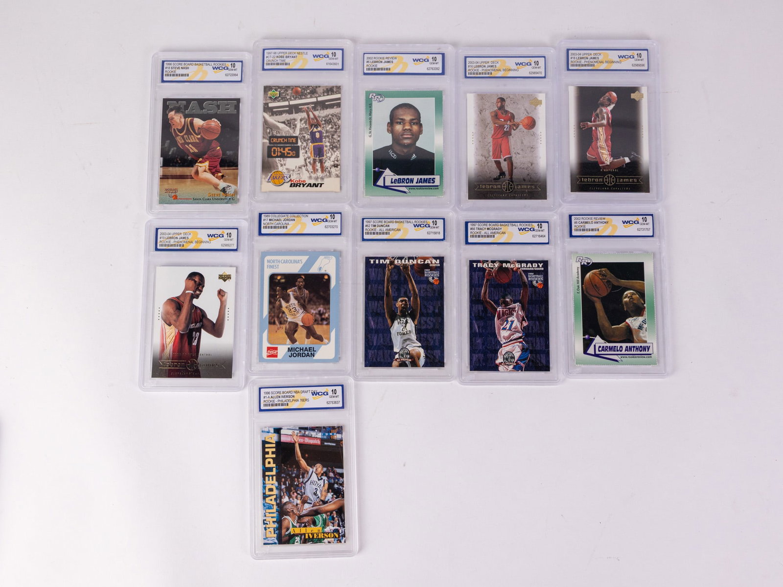 Assorted WCG Graded Collectible Basketball Cards: Assorted WCG Graded Collectible Basketball Cards Size 7" x 12" x 12" Literature Brooks Auction – Online Auction Terms & Conditions Contact: (856) 694-2960 | info@brooks.auction READ BEFORE Y