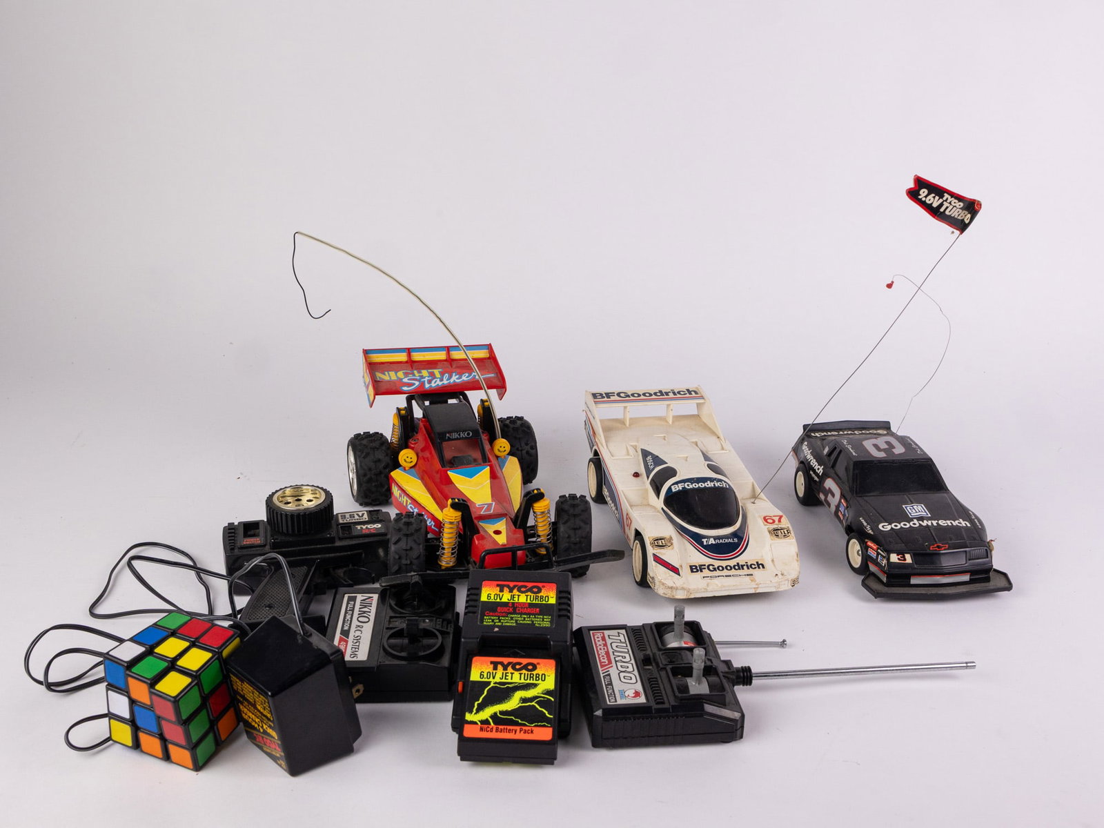Assortment of RC Vehicles and Remotes - 2