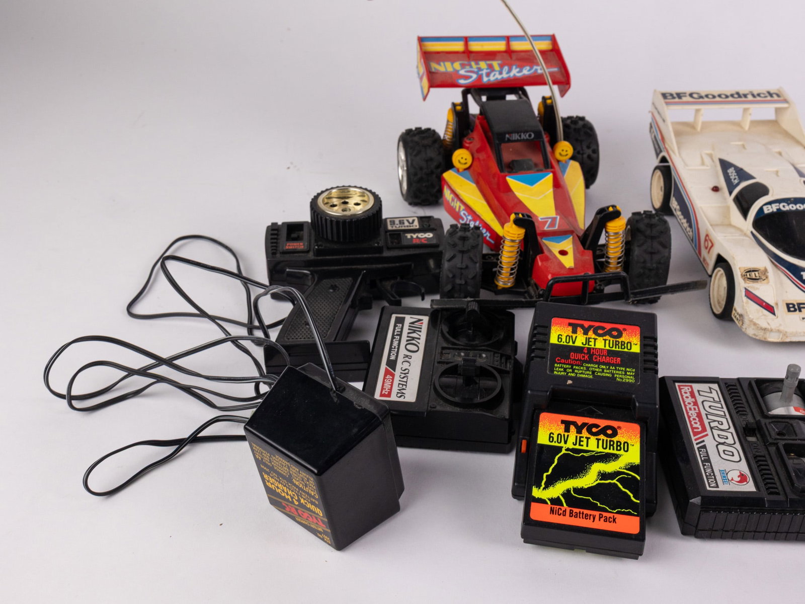 Assortment of RC Vehicles and Remotes - 3