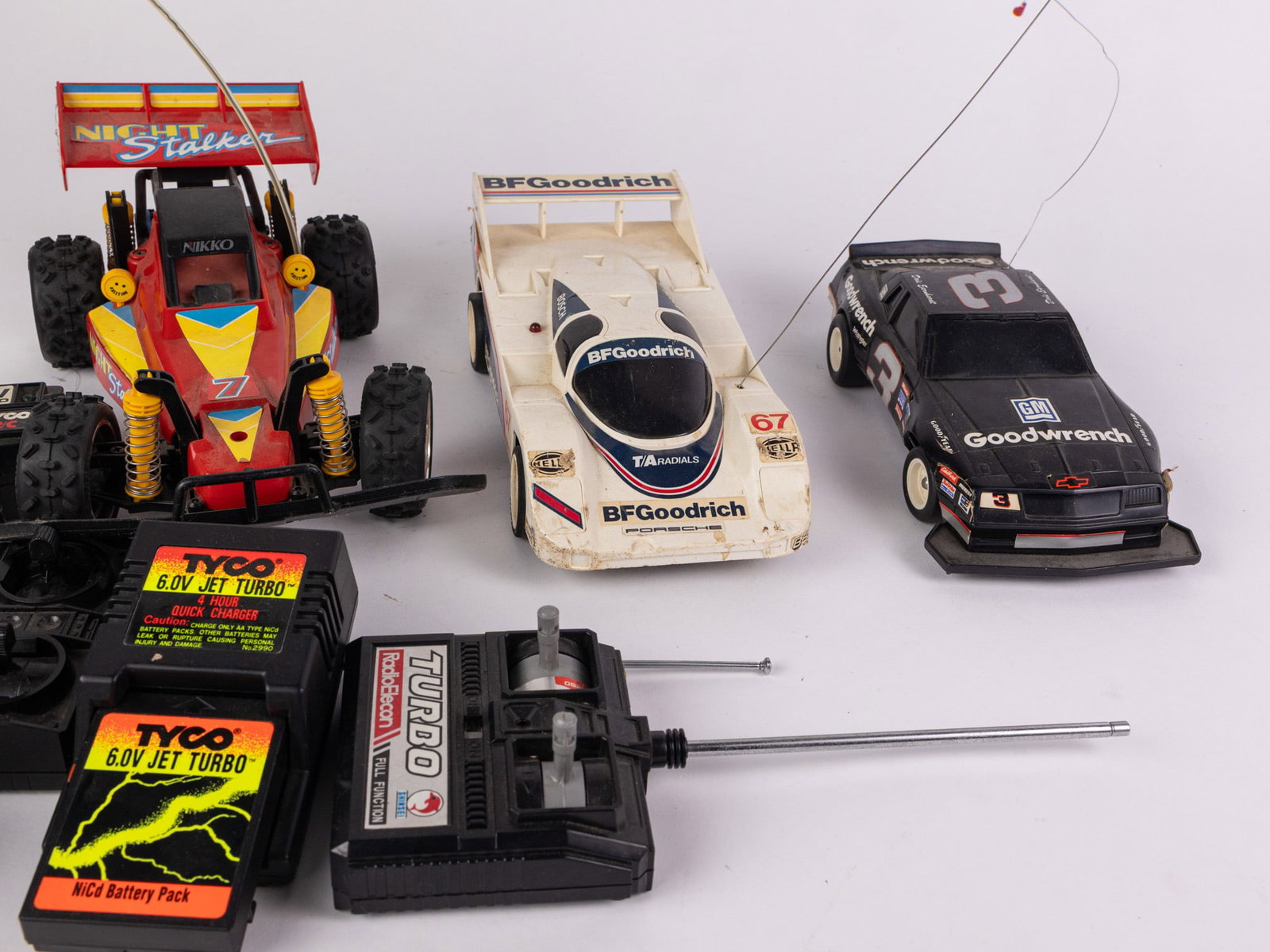 Assortment of RC Vehicles and Remotes - 4
