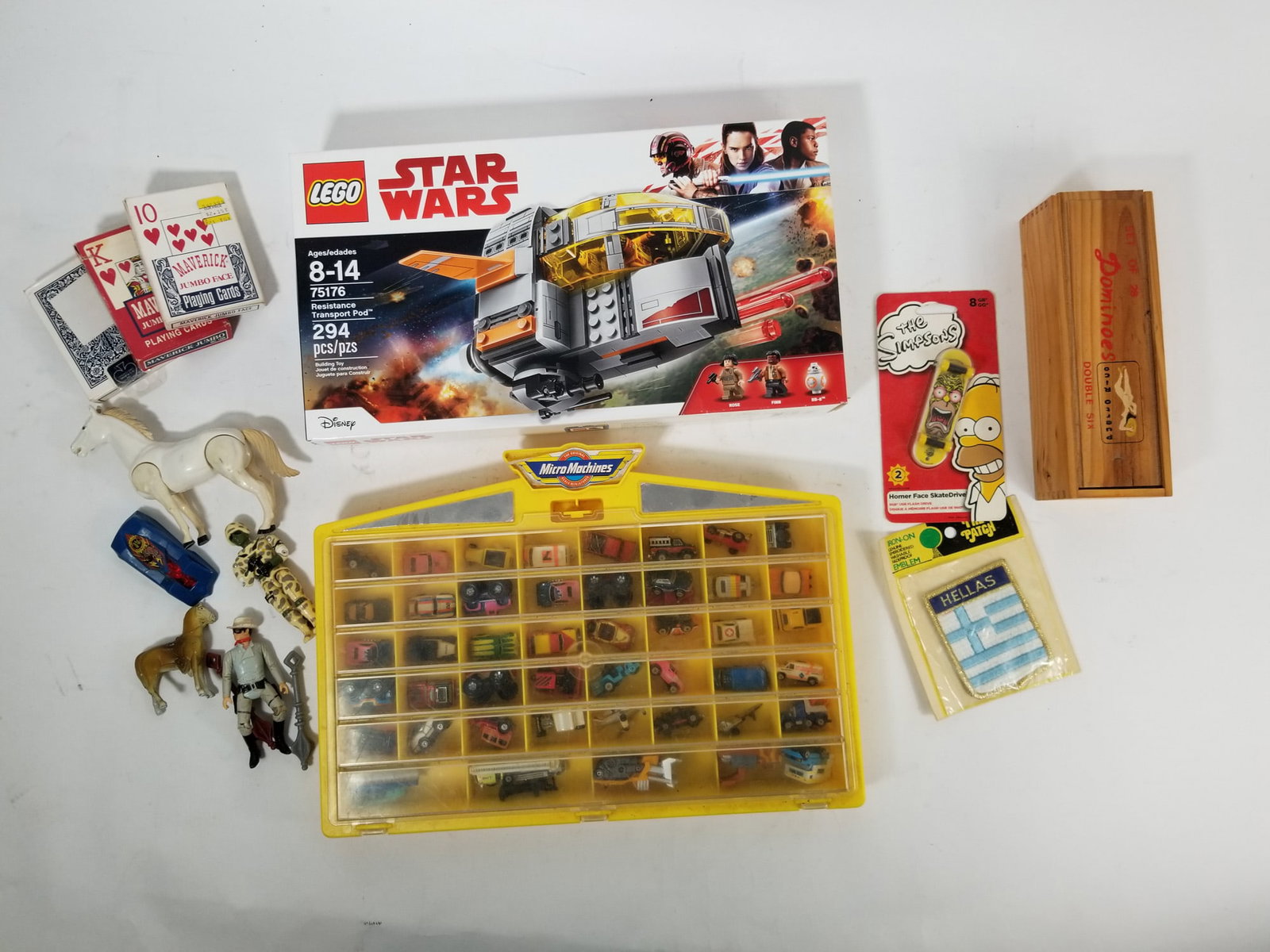 Assorted Toys and Games Featuring Micro Machines & LEGO: Assorted Toys and Games Featuring Micro Machines & LEGO Size 7" x 12" x 12" Literature Brooks Auction – Online Auction Terms & Conditions Contact: (856) 694-2960 | info@brooks.auction READ