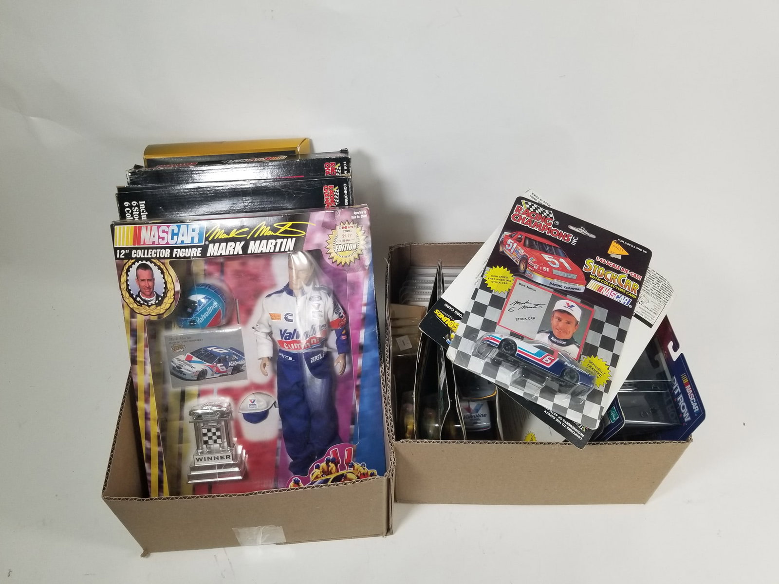 Assorted NASCAR Collectibles: Assorted NASCAR Collectibles Size 7" x 12" x 12" Literature Brooks Auction – Online Auction Terms & Conditions Contact: (856) 694-2960 | info@brooks.auction READ BEFORE YOU BID: We want you to