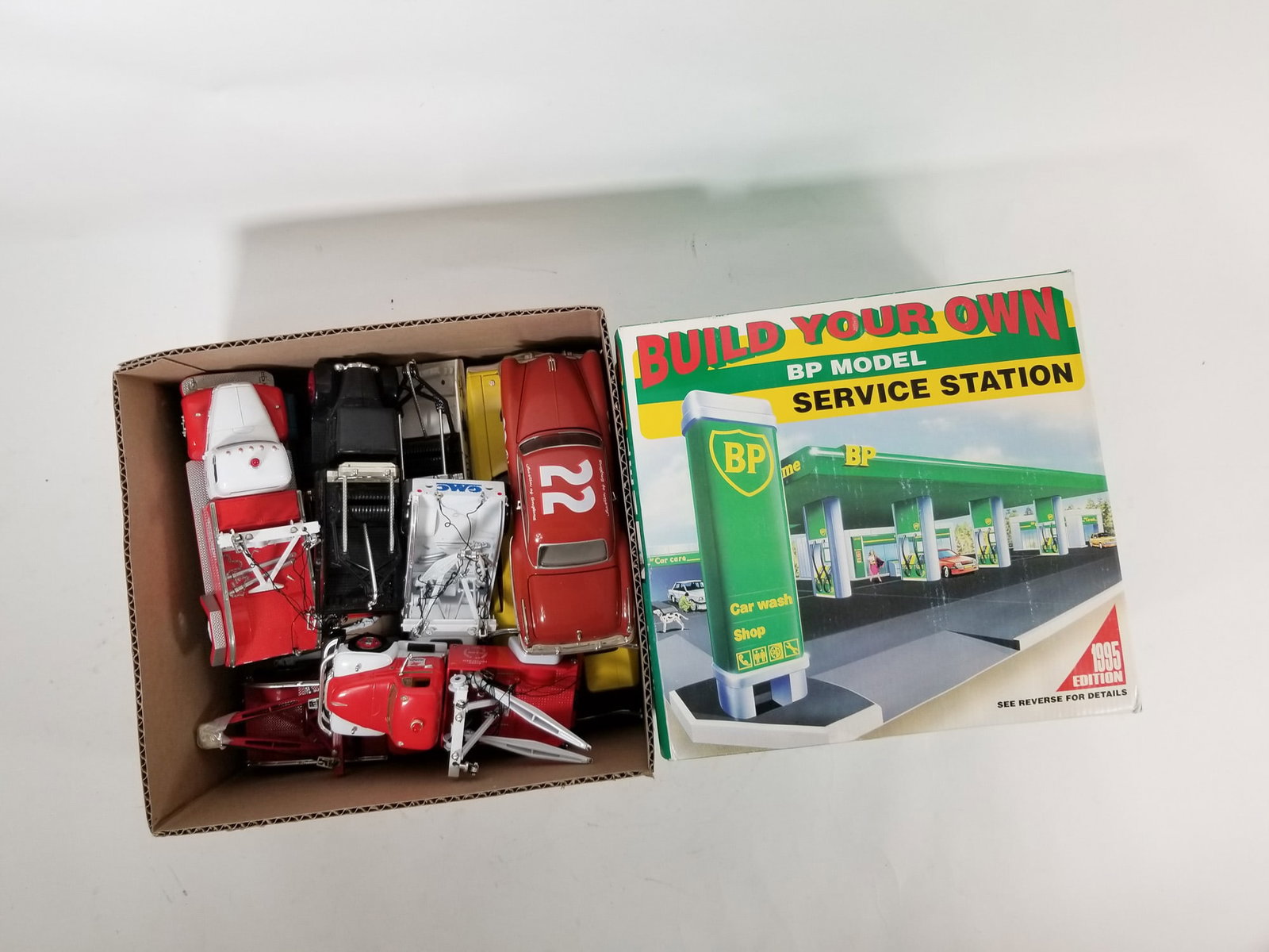 Assortment of Vintage Diecast Automobiles ft. Pair of Build Your Own BP Service Stations: Assortment of Vintage Diecast Automobiles ft. Pair of Build Your Own BP Service Stations Size 7" x 12" x 12" Literature Brooks Auction – Online Auction Terms & Conditions Contact: (856)
