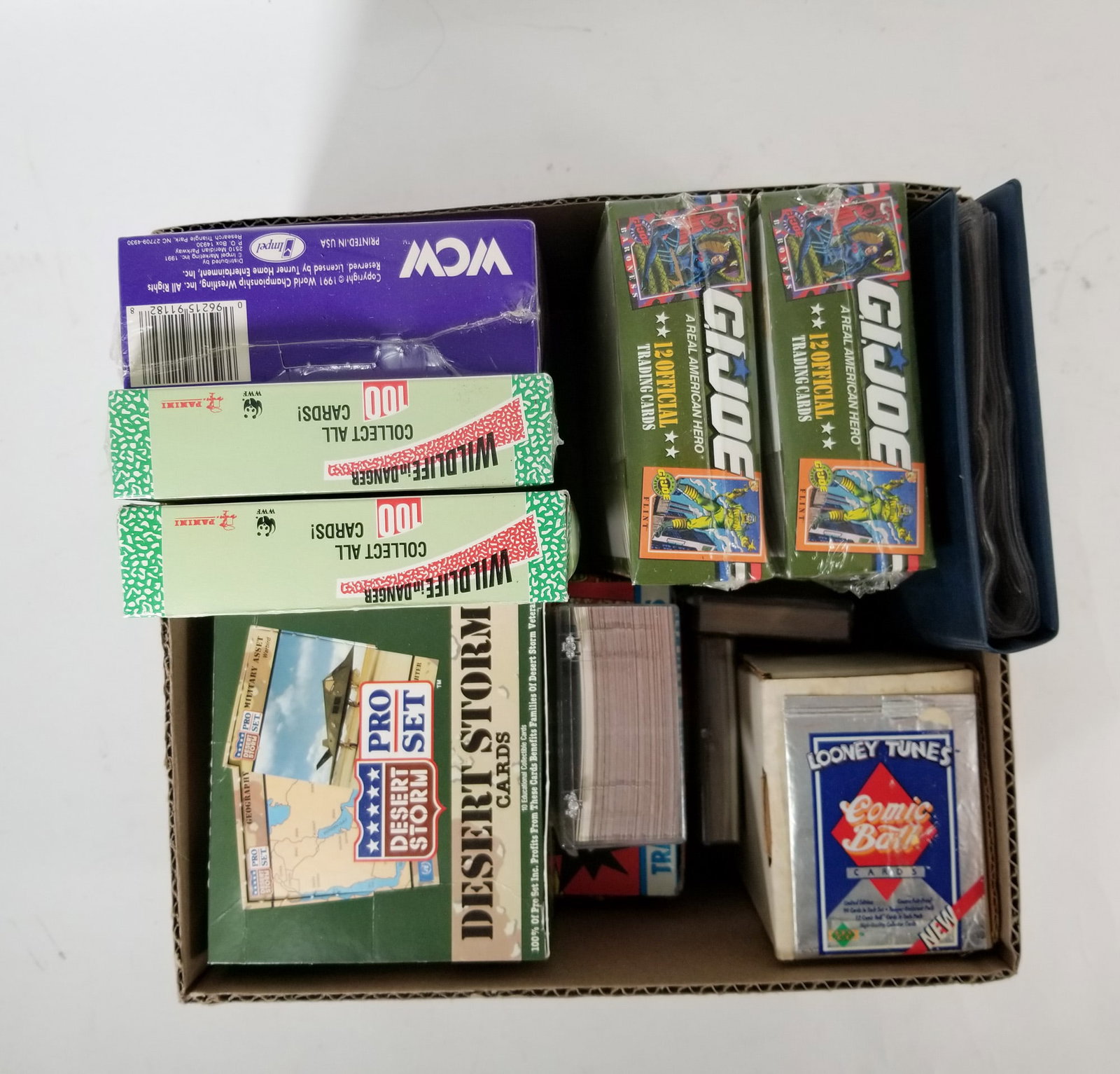 Assortment of Military-Themed Trading Cards ft. GI Joe: Assortment of Military-Themed Trading Cards ft. GI Joe Size 7" x 12" x 12" Literature Brooks Auction – Online Auction Terms & Conditions Contact: (856) 694-2960 | info@brooks.auction READ