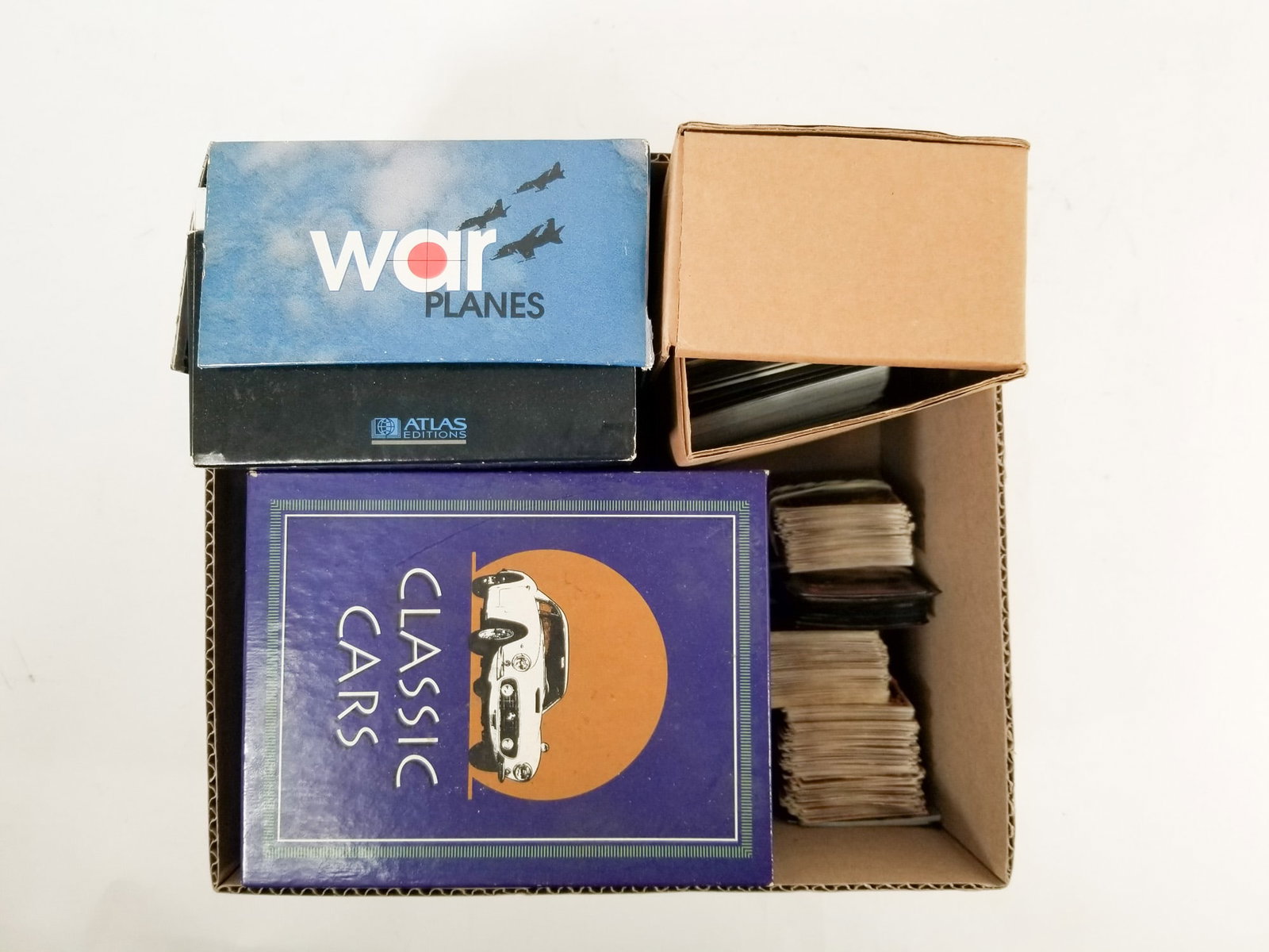 Assortment of Trading Cards ft. Classic Cars: Assortment of Trading Cards ft. Classic Cars Size 7" x 12" x 12" Literature Brooks Auction – Online Auction Terms & Conditions Contact: (856) 694-2960 | info@brooks.auction READ BEFORE YOU BID: