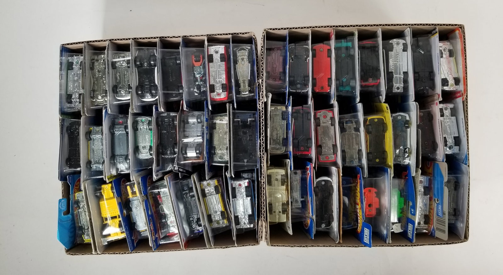 Assortment of Miniature Die-Cast Cars ft. Hot Wheels: Assortment of Miniature Die-Cast Cars ft. Hot Wheels Size 7" x 12" x 12" Literature Brooks Auction – Online Auction Terms & Conditions Contact: (856) 694-2960 | info@brooks.auction READ BEFO