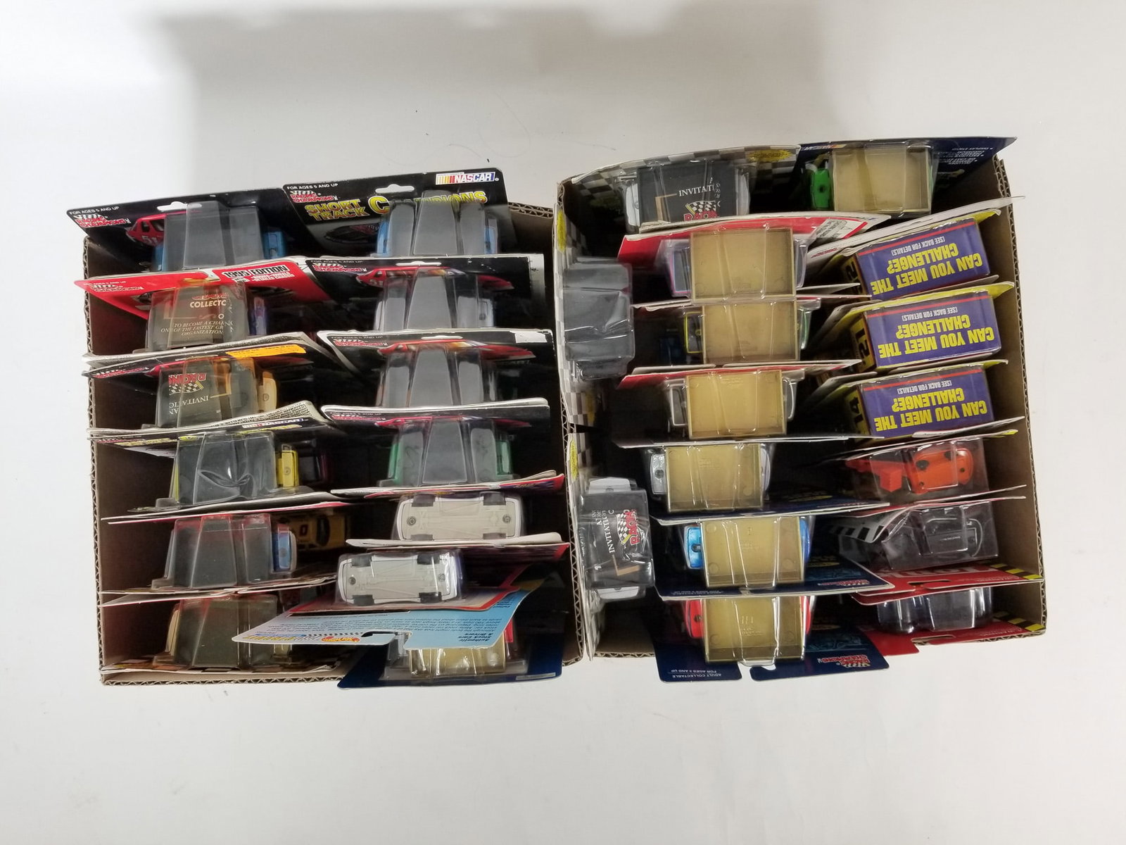 Assortment of Miniature Die-Cast Cars ft. Racing Champions: Assortment of Miniature Die-Cast Cars ft. Racing Champions Size 7" x 12" x 12" Literature Brooks Auction – Online Auction Terms & Conditions Contact: (856) 694-2960 | info@brooks.auction READ