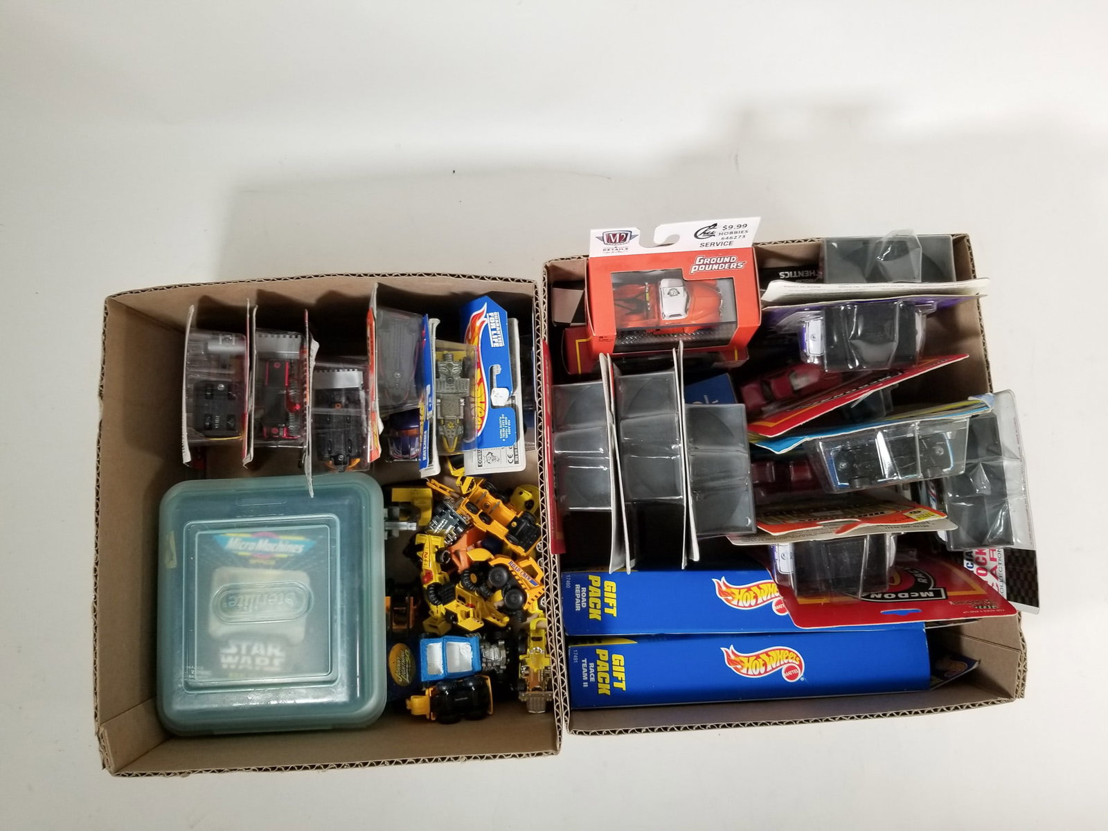 Assortment of Miniature Die-Cast Cars ft. Hot Wheels Gift Packs: Assortment of Miniature Die-Cast Cars ft. Hot Wheels Gift Packs Size 7" x 12" x 12" Literature Brooks Auction – Online Auction Terms & Conditions Contact: (856) 694-2960 | info@brooks.auction