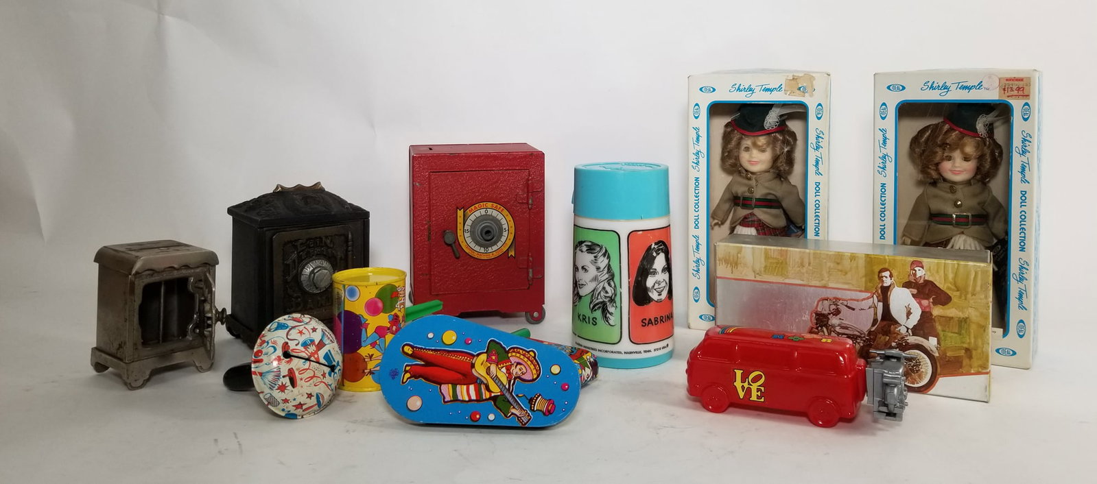 Miscellaneous Lot: Vintage Noisemakers - Avon Cologne - Pair of Shirley Temple Ideal Dolls - and more! Size 7" x 12" x 12" Literature Brooks Auction – Online Auction Terms & Conditions Contact: (856) 694-2960 | i