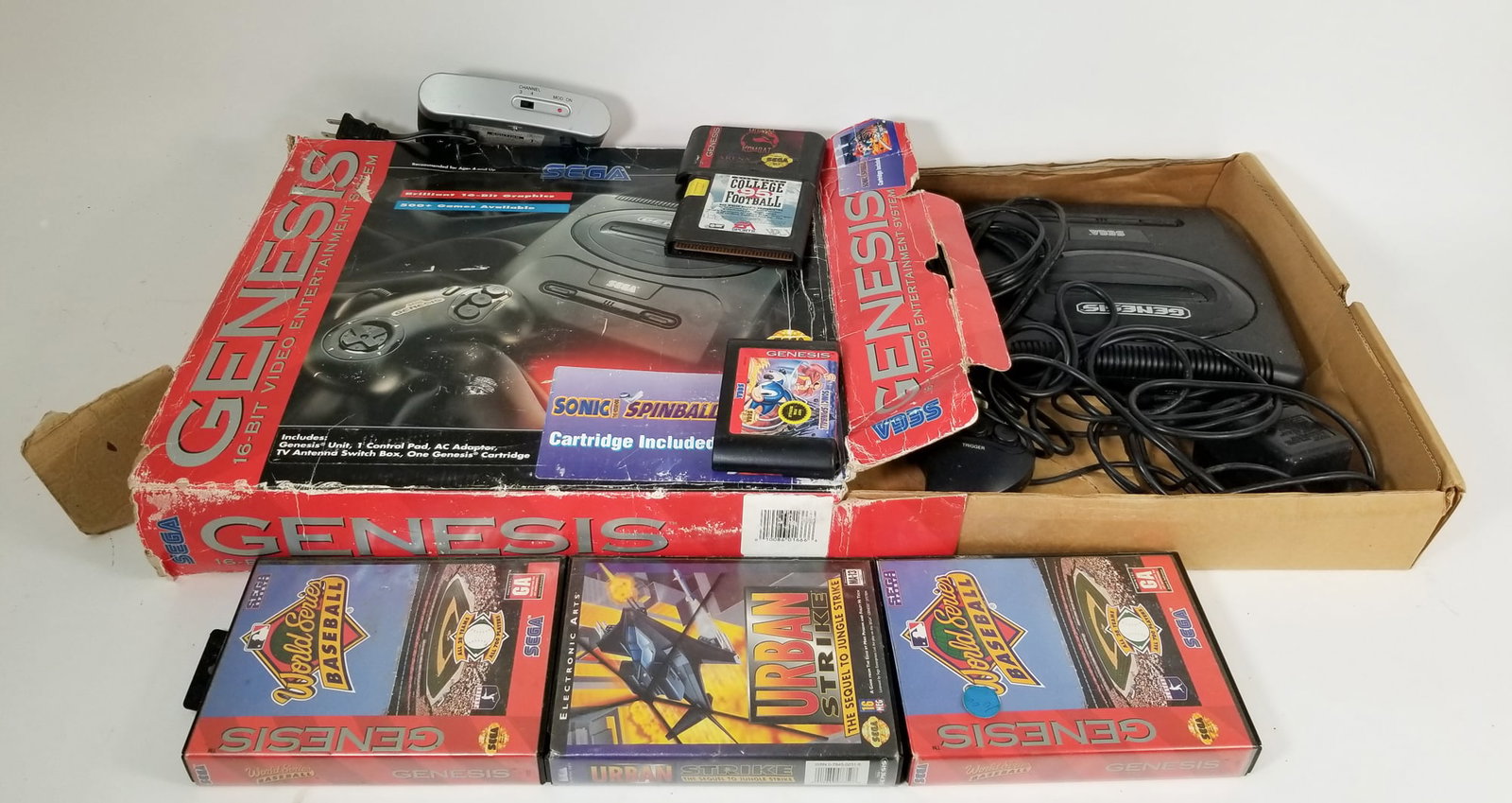 Vintage Sega Genesis Console and Games ft. Mortal Kombat: Vintage Sega Genesis Console and Games ft. Mortal Kombat Size 9" x 15" x 17" Literature Brooks Auction – Online Auction Terms & Conditions Contact: (856) 694-2960 | info@brooks.auction READ