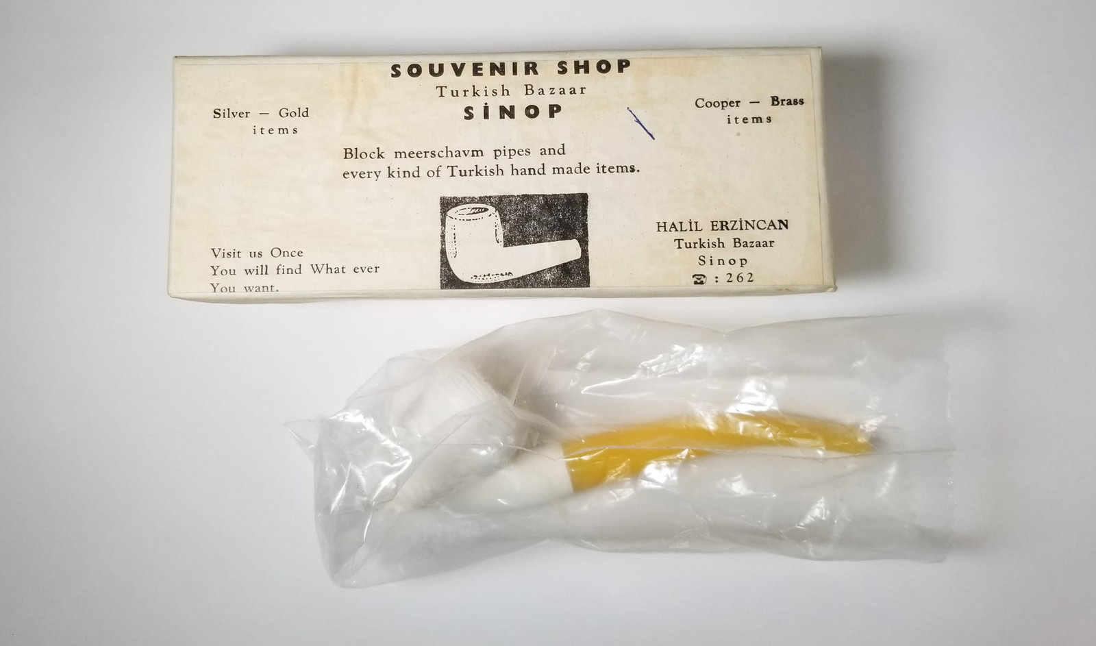 Vintage Figural Meerschaum Pipe in Original Box: Figural meerschaum pipe in the shape of a man's head in original Turkish Bazaar souvenir shop box. Size 3" x 7" x 2" Literature Brooks Auction – Online Auction Terms & Conditions Contact: (856)