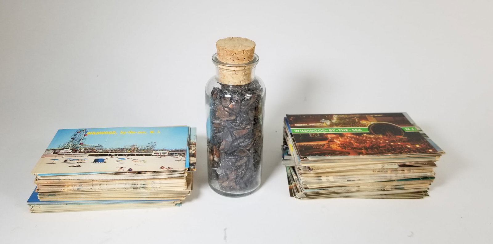 Vintage Wildwood Deadstock Post Cards and Collected Shark's Teeth: Vintage Wildwood Deadstock Post Cards and Collected Shark's Teeth Size 7" x 12" x 12" Literature Brooks Auction – Online Auction Terms & Conditions Contact: (856) 694-2960 | info@brooks.auction